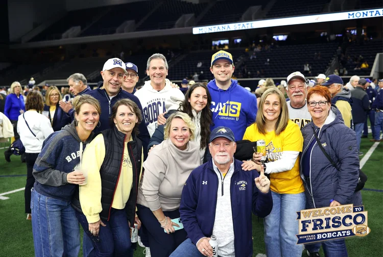 Branded group photo on a stadium field in Frisco