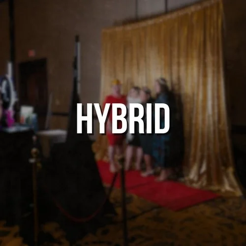 People standing on a red carpet in front of a gold curtain at a photo booth.