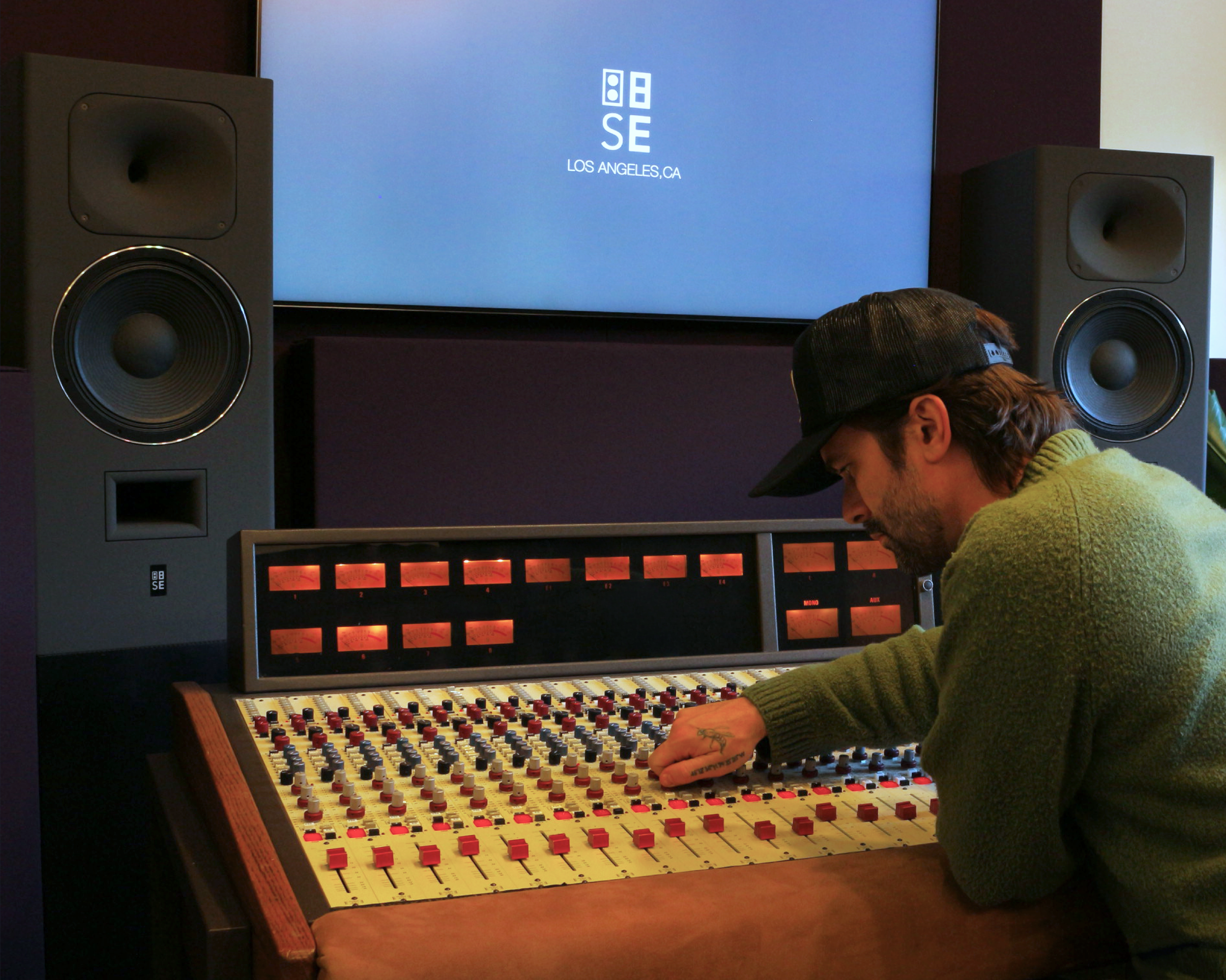 Matthew Genovese working at the vintage Quad Eight Pacifica console in the Analog in the Digital control room.