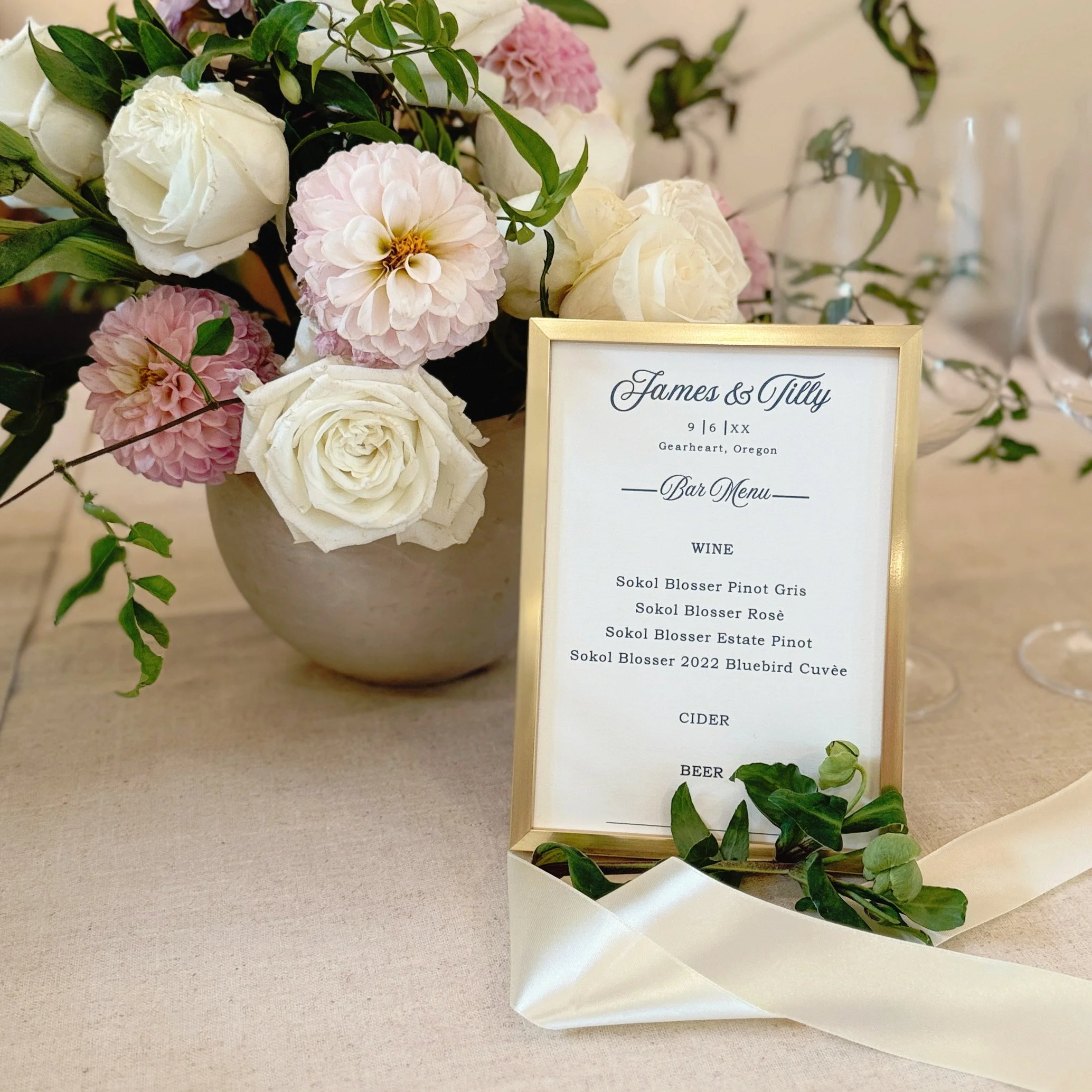 The bar menu can tie in with the invitations, signage and place setting menus.  The cohesive elements are a nice touch to your event. 
