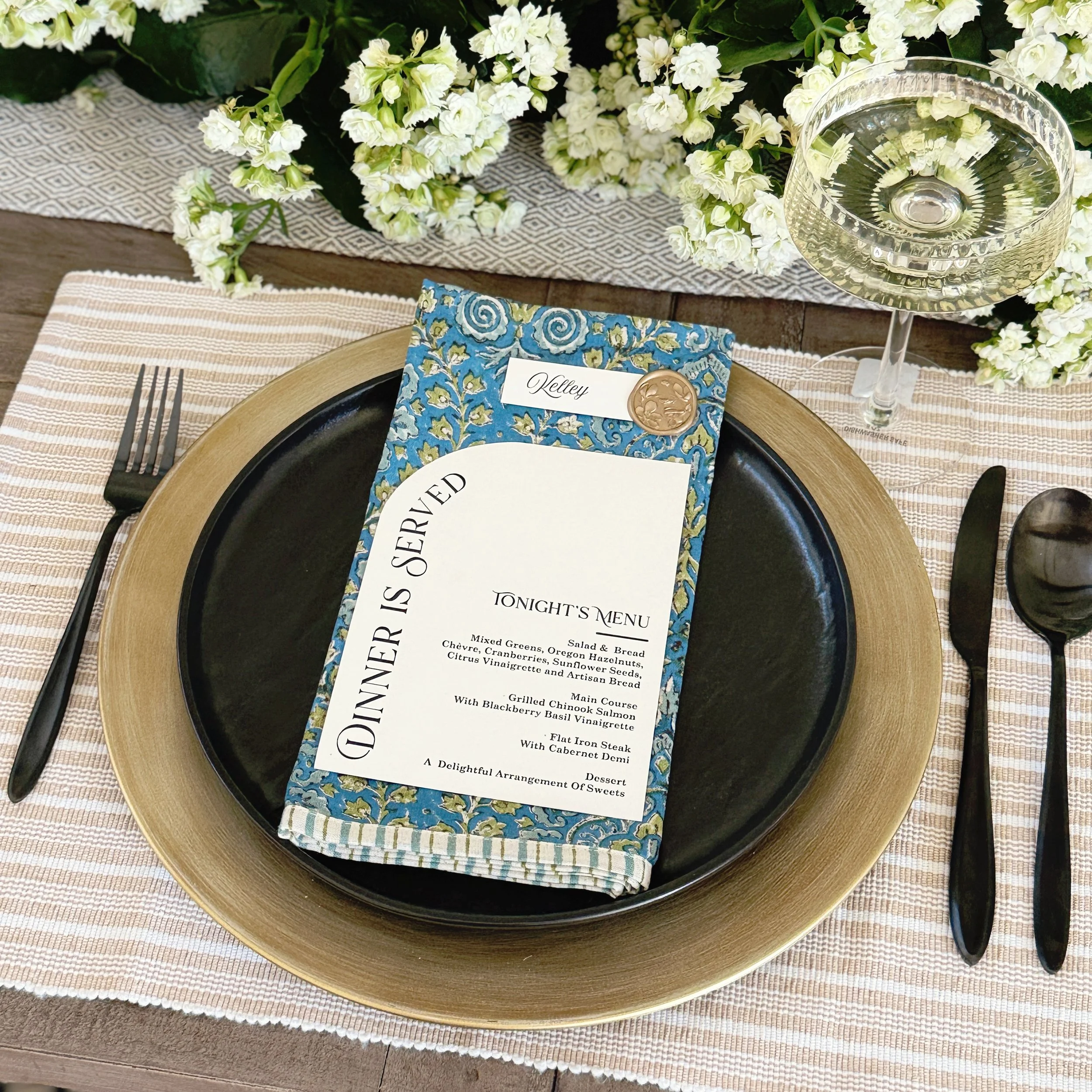 The arched edge menu was a special request from the mother of the bride, who wanted the text to follow the curve. Paired with a sealed place card, this combination quickly became one of our all time favorites!