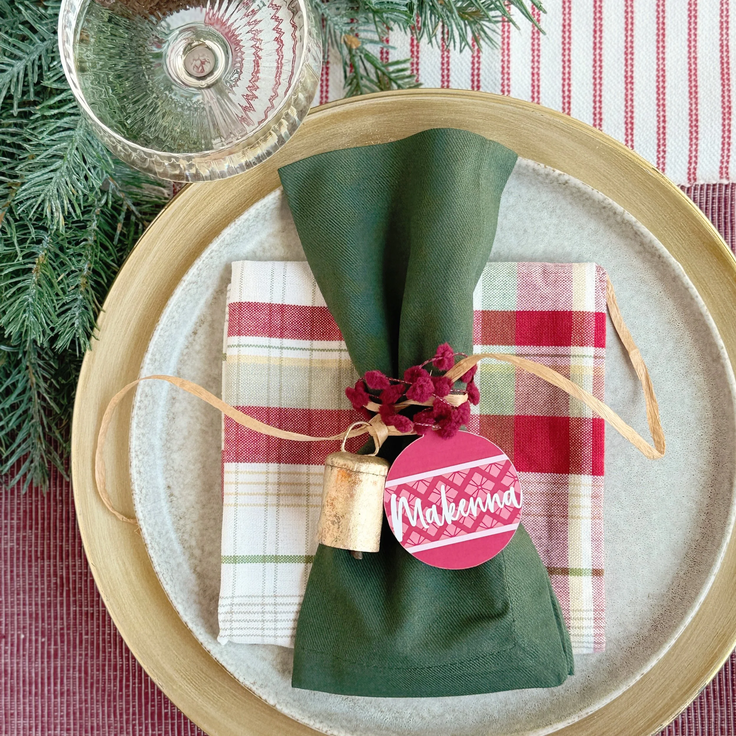 Gathering around the table for the holidays is even more special with ornament shaped place cards. Tied around each napkin, they add a festive touch and make the table feel extra special.