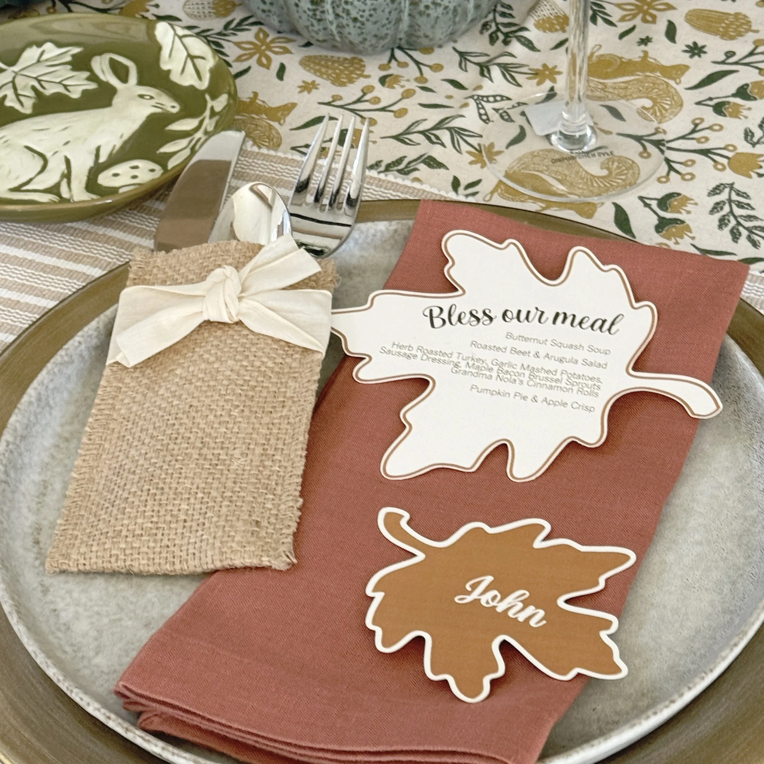 Thanksgiving is a time to gather! Custom leaf-shaped menus and place cards were layered on each plate, bringing the beauty of fall to the table and making decorating a snap.