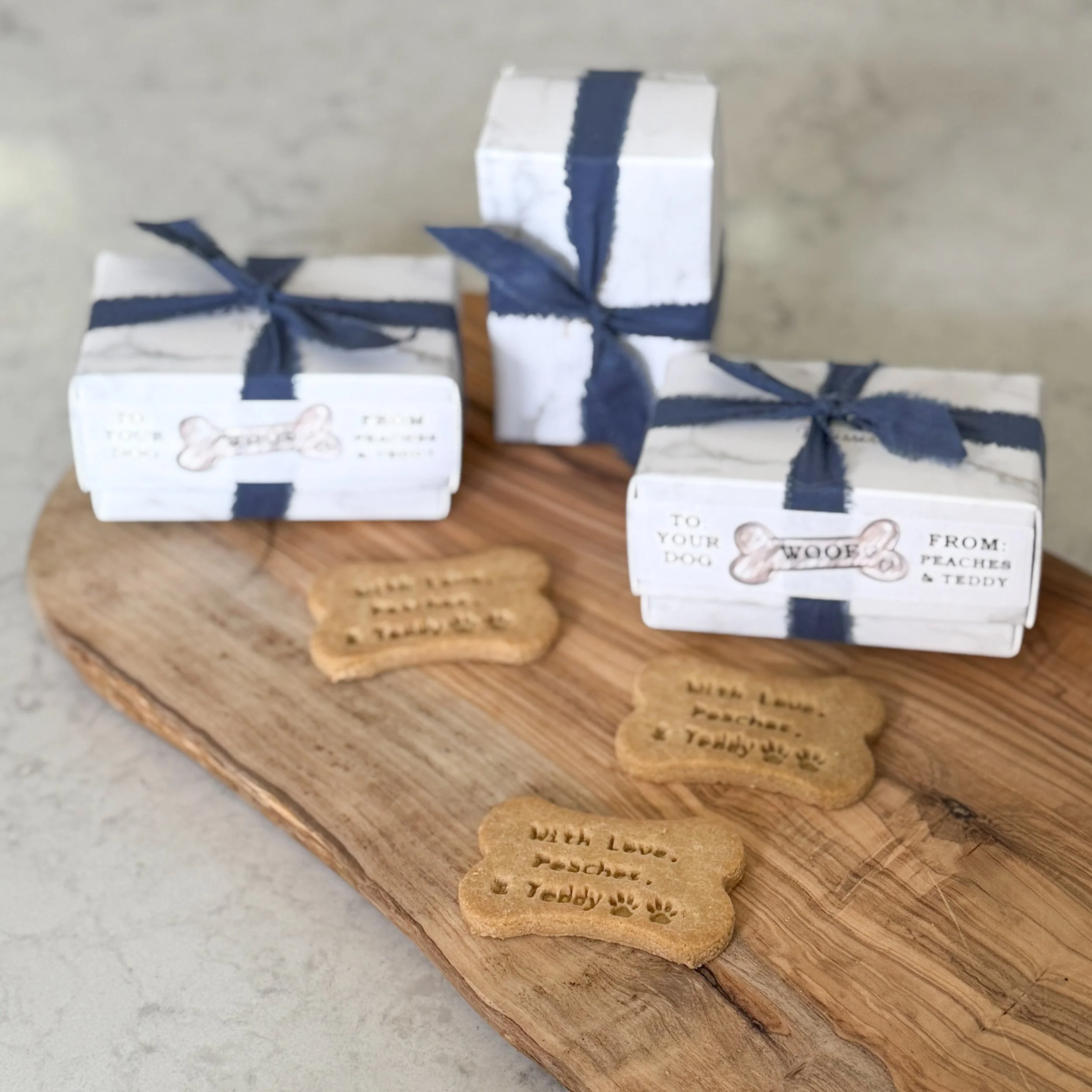 Don't forget the doggies during your celebration!  This wedding included dogs. The couple wanted their dogs to spread their love of treats too with their very own customized dog treats for the all their friend's owners to take home to them. 