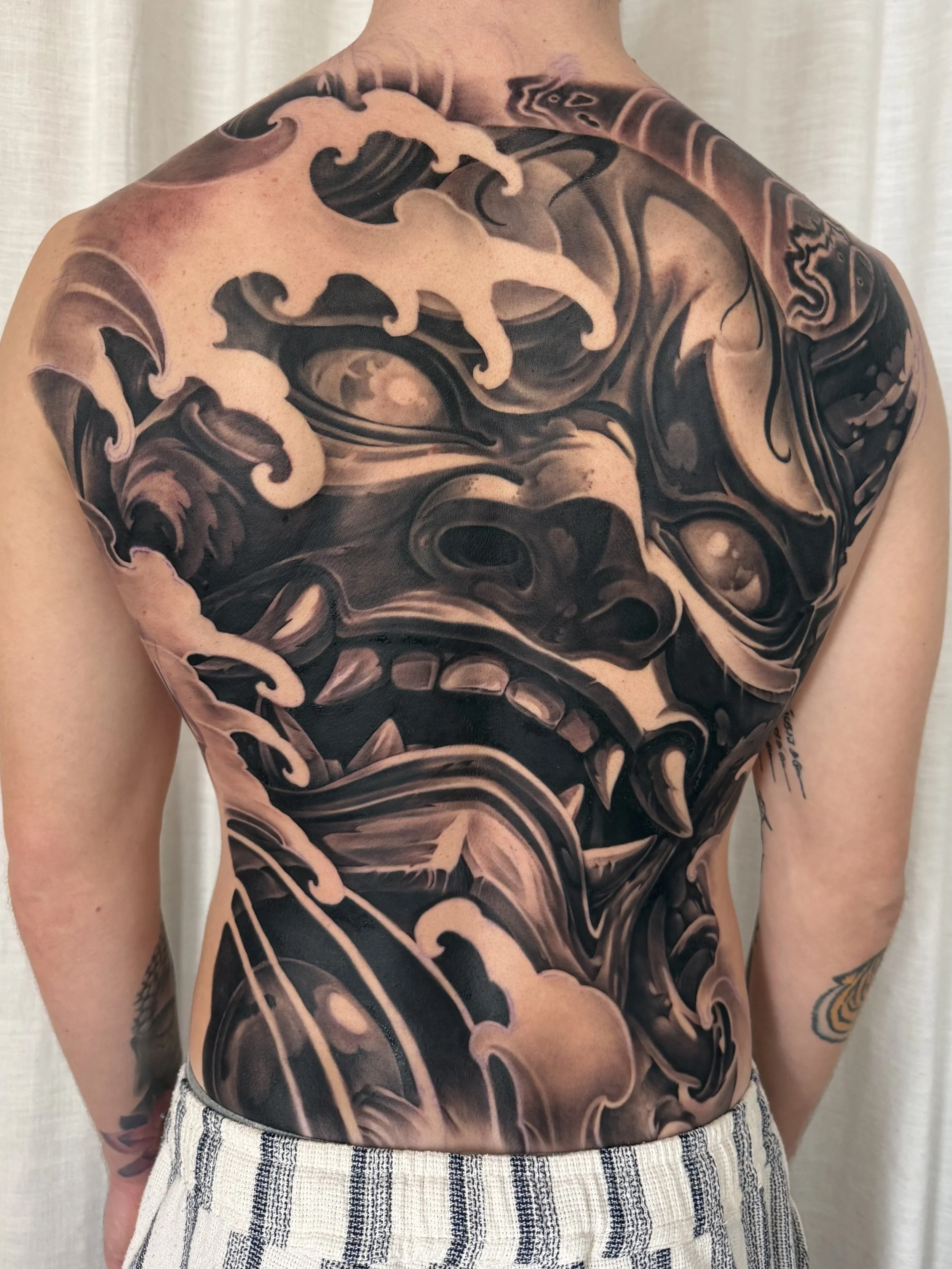 Full back black and grey Japanese Hannya done by Ray at Markd Tattoo Sydney