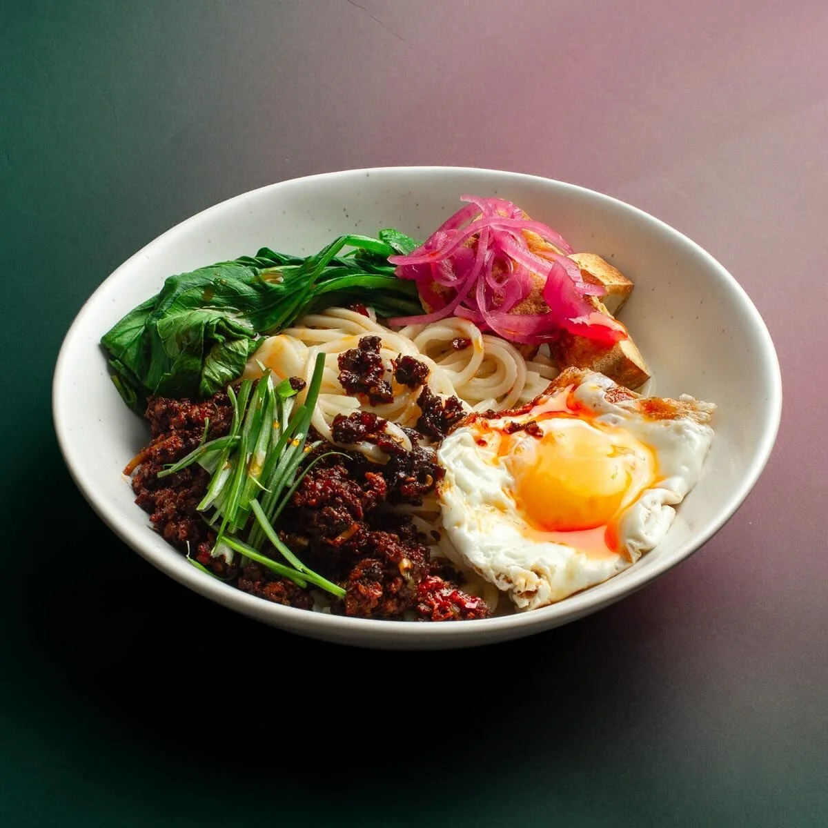 A pantry pasta I made a few weeks ago as an excuse to test out some Chili Oil courtesy of @dsmramenclub. 

Fake beef crumbles fried with scallion, ginger, doubanjiang, soy sauce, and sesame oil. Blanched yuchoy (I think?), pickled red onions, and a r