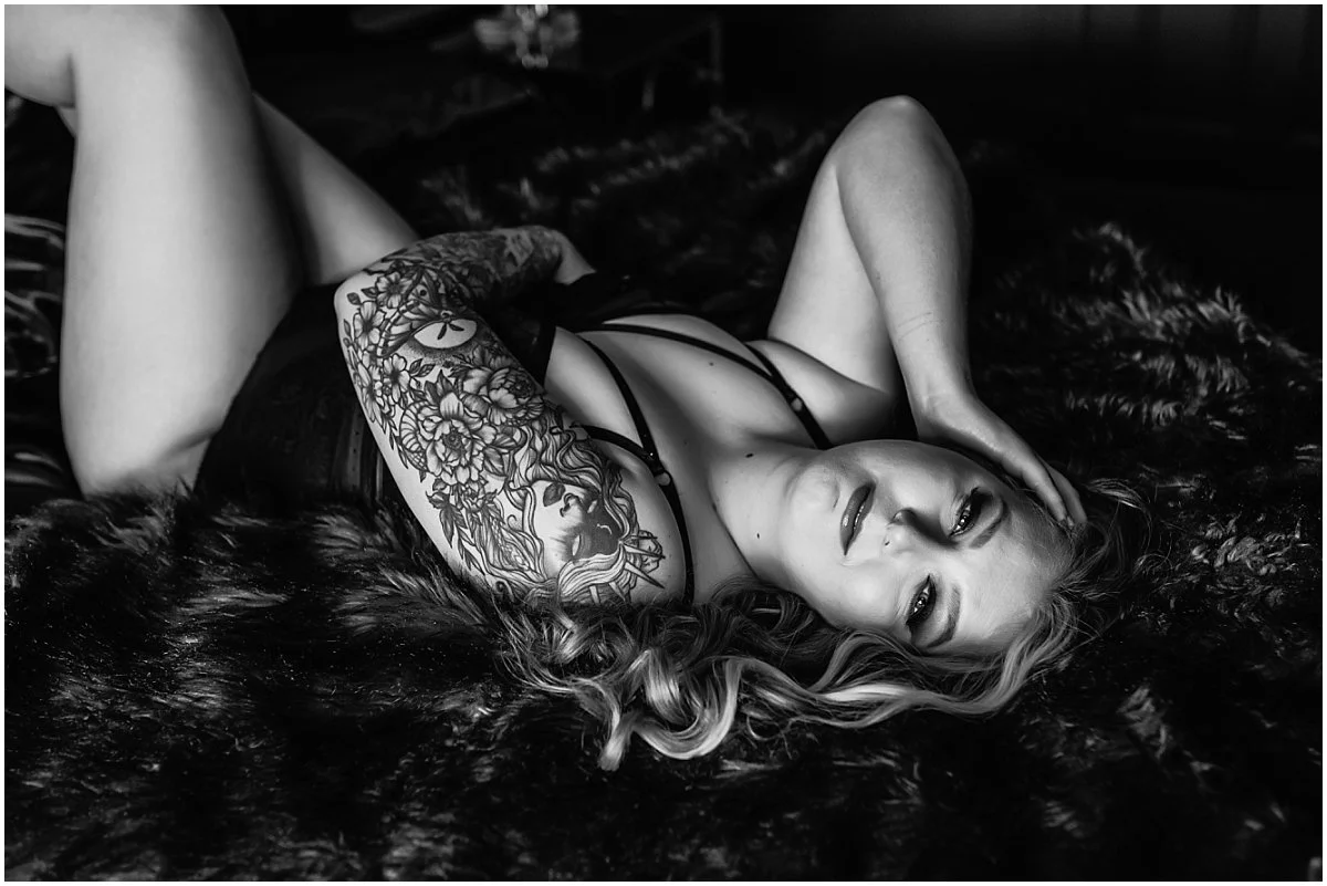 Confident boudoir portrait of a woman in Jacksonville, Florida embracing her sensuality and body confidence after motherhood