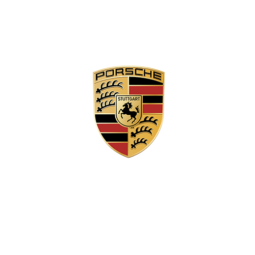 Close-up of the Porsche logo on a gold background.
