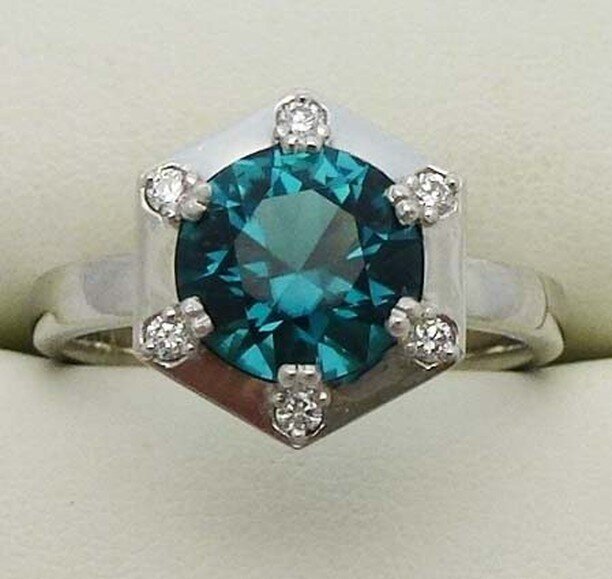 Platinum, Green-blue Tourmaline and brilliant-cut diamond ring.