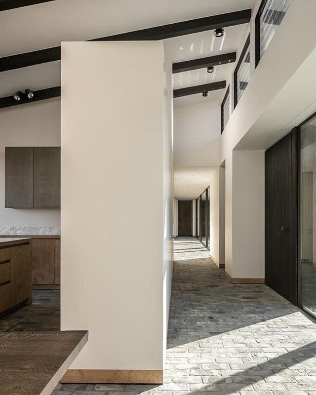 The entrance space leading to the corridor of the bedrooms with next to it the bespoke kitchen in this house in the countryside. Architecture and Interior Design by @stef_claes Photography by @cafeine Woodwork by @diapal.be #architecture #interior #d