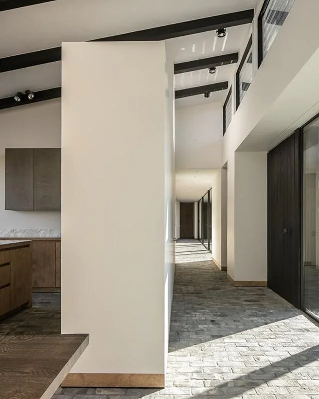 The entrance space leading to the corridor of the bedrooms with next to it the bespoke kitchen in this house in the countryside. Architecture and Interior Design by @stef_claes Photography by @cafeine Woodwork by @diapal.be #architecture #interior #d