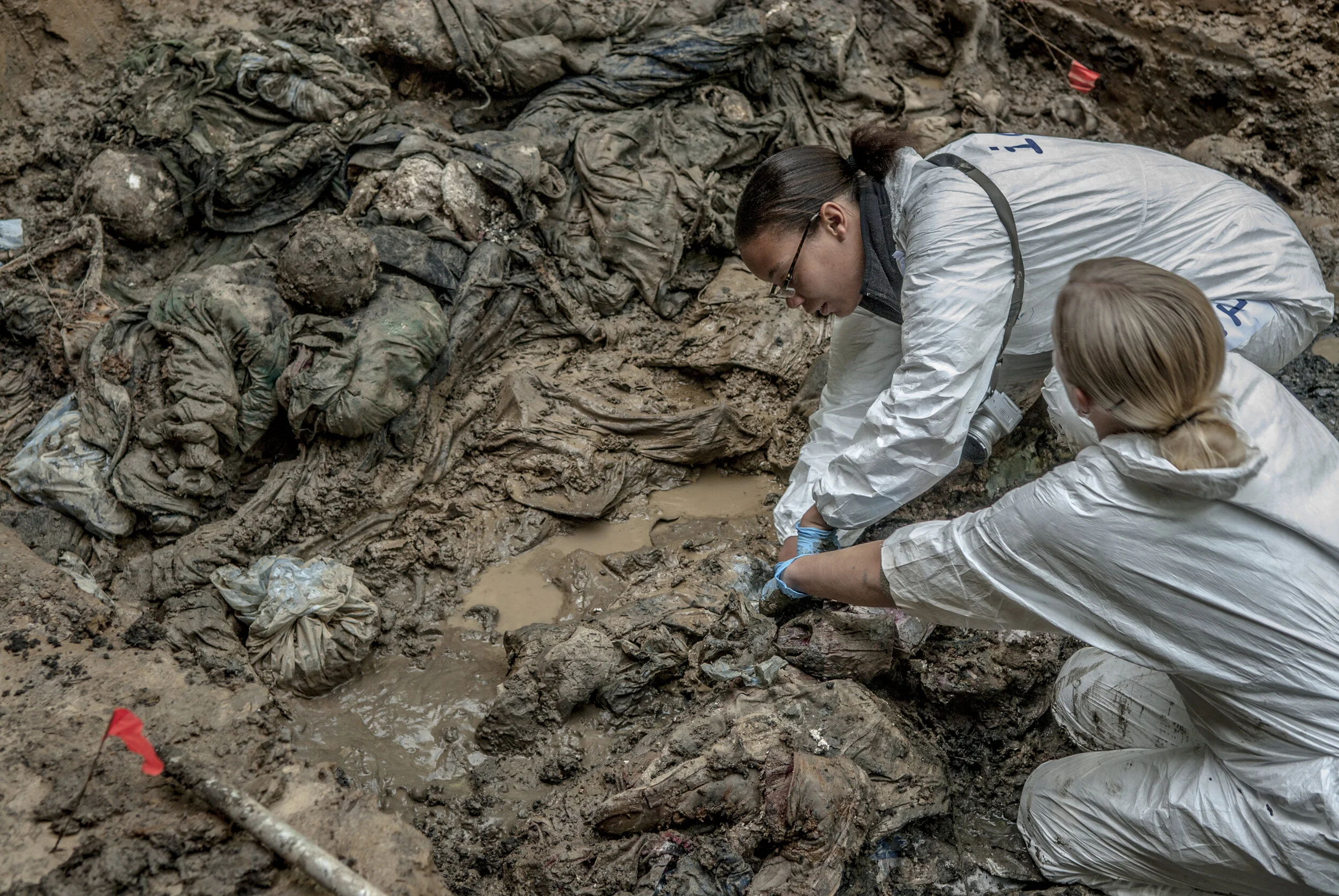  A Forensic Archaelogist and a Forensic Anthropologist from the  ICMP (International Committee for Missing Persons) exhume the bodies of Bosniak men executed during the Bosnian war from a mass grave near Sekovici in Republica Srpska. It is suspected 