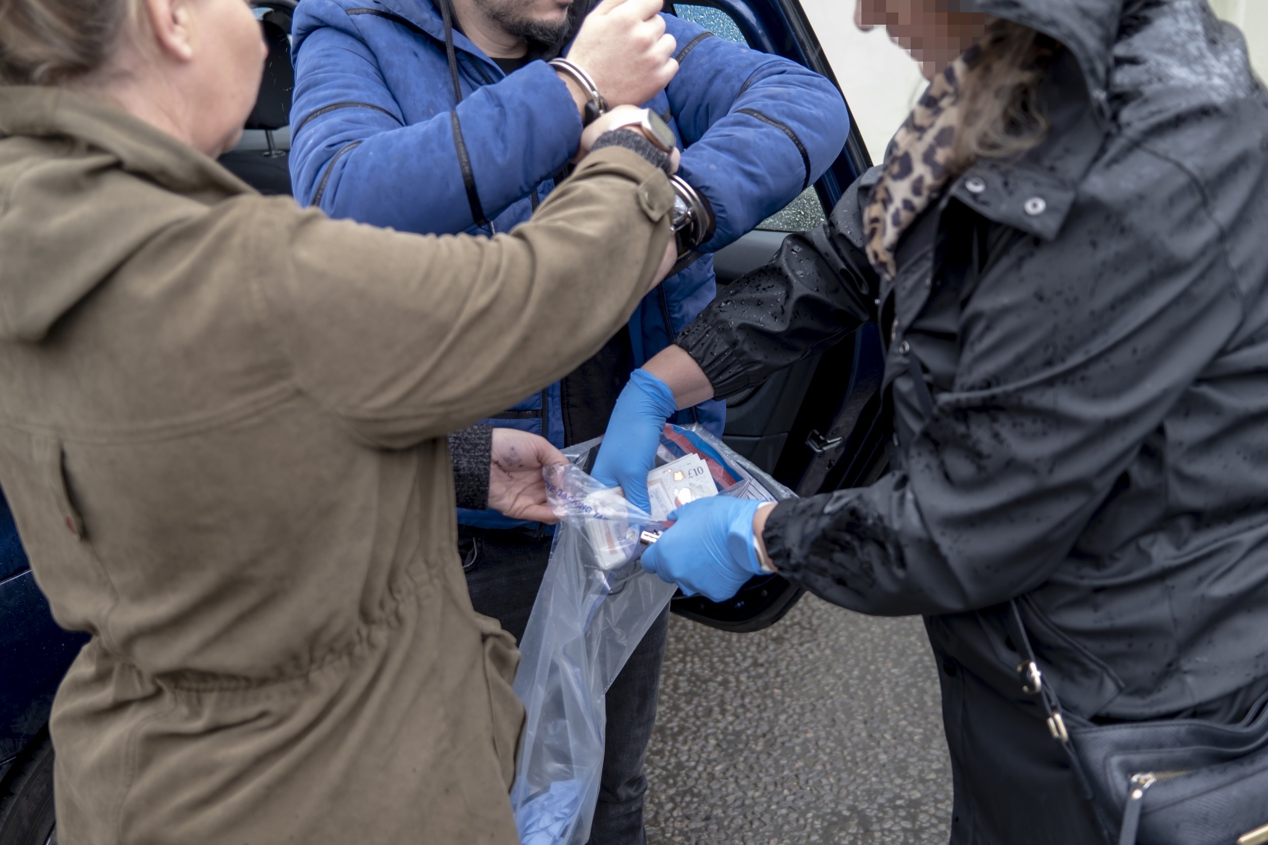 The Modern Slavery team makes an arrest during an operation in the Midlands.