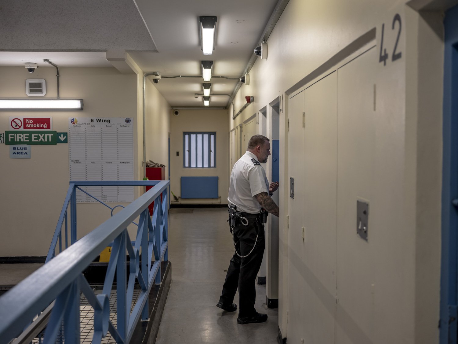 A prison officer does the rounds to check on inmates in their cells. HMP Full Sutton.