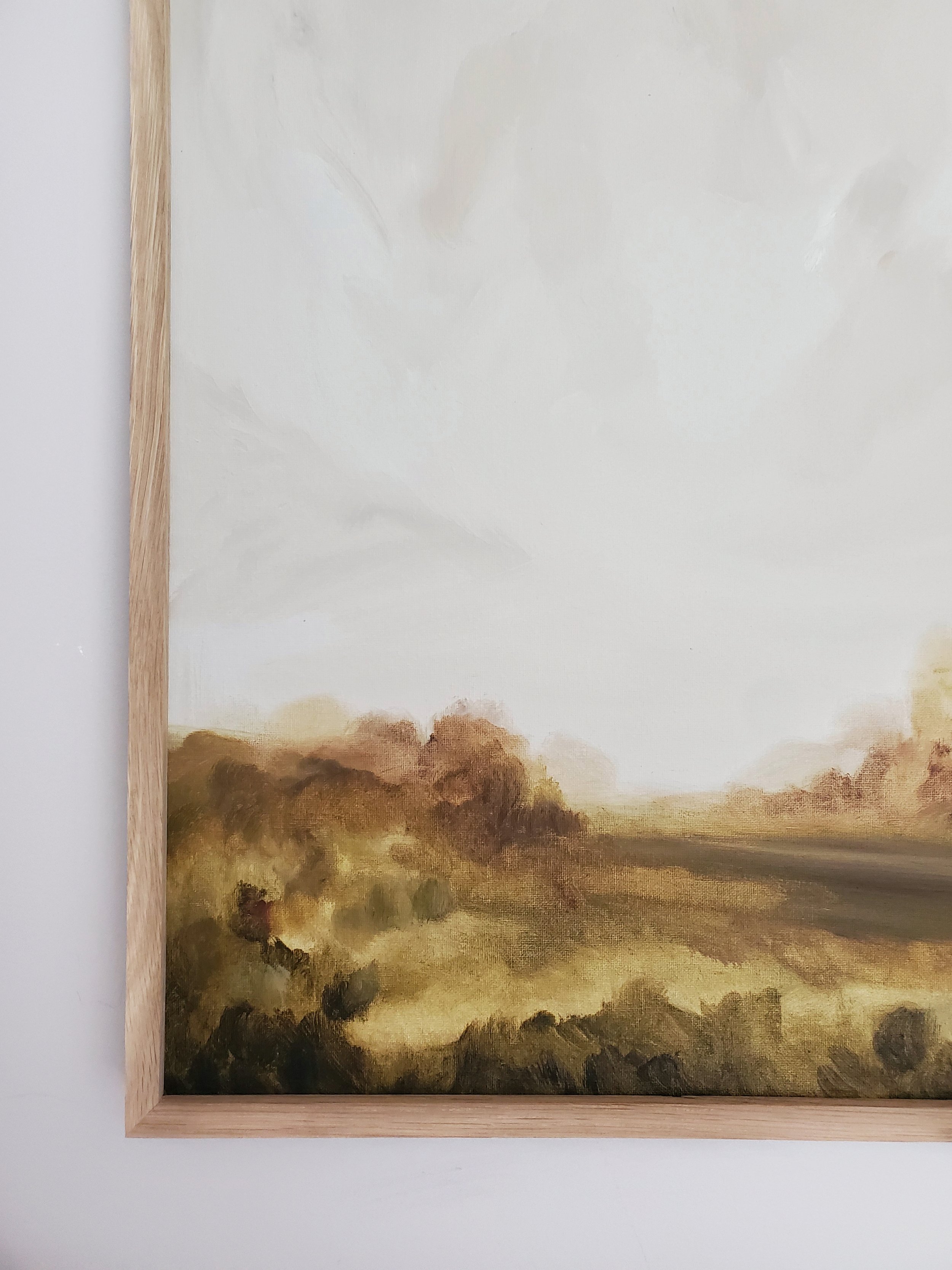 landscape artwork framed in oak wood frame.jpeg
