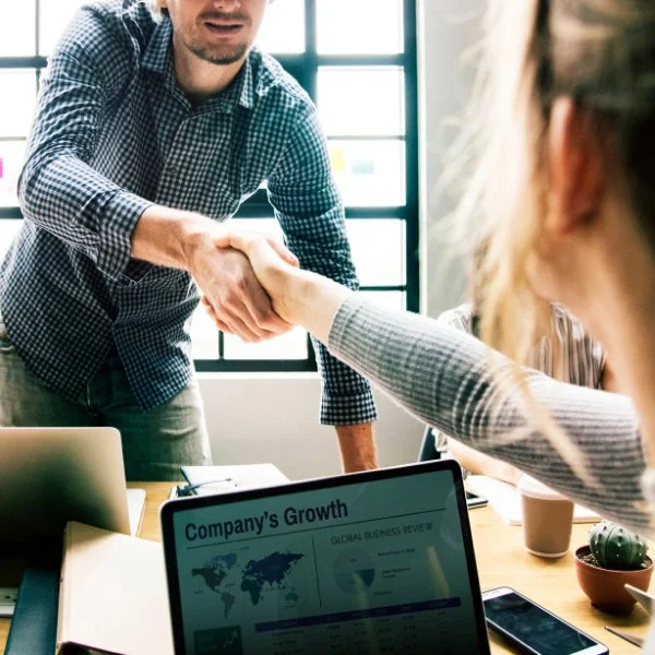 Business consulting meeting focused on unlocking company value and growth potential.