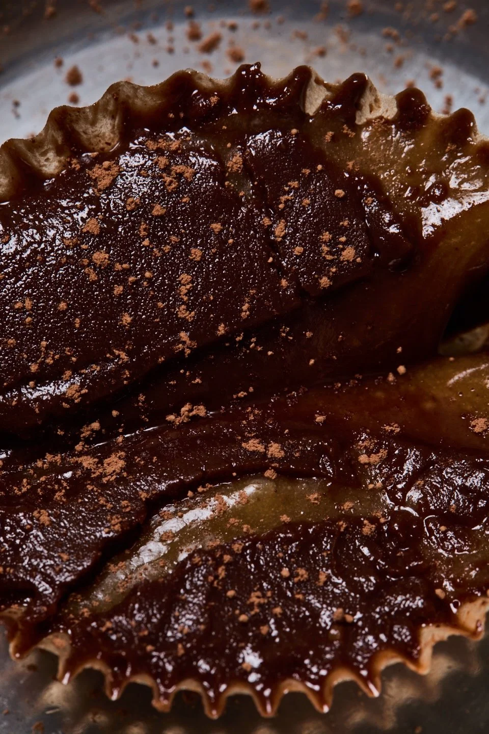close detail of a dark galette with a glossy center.
