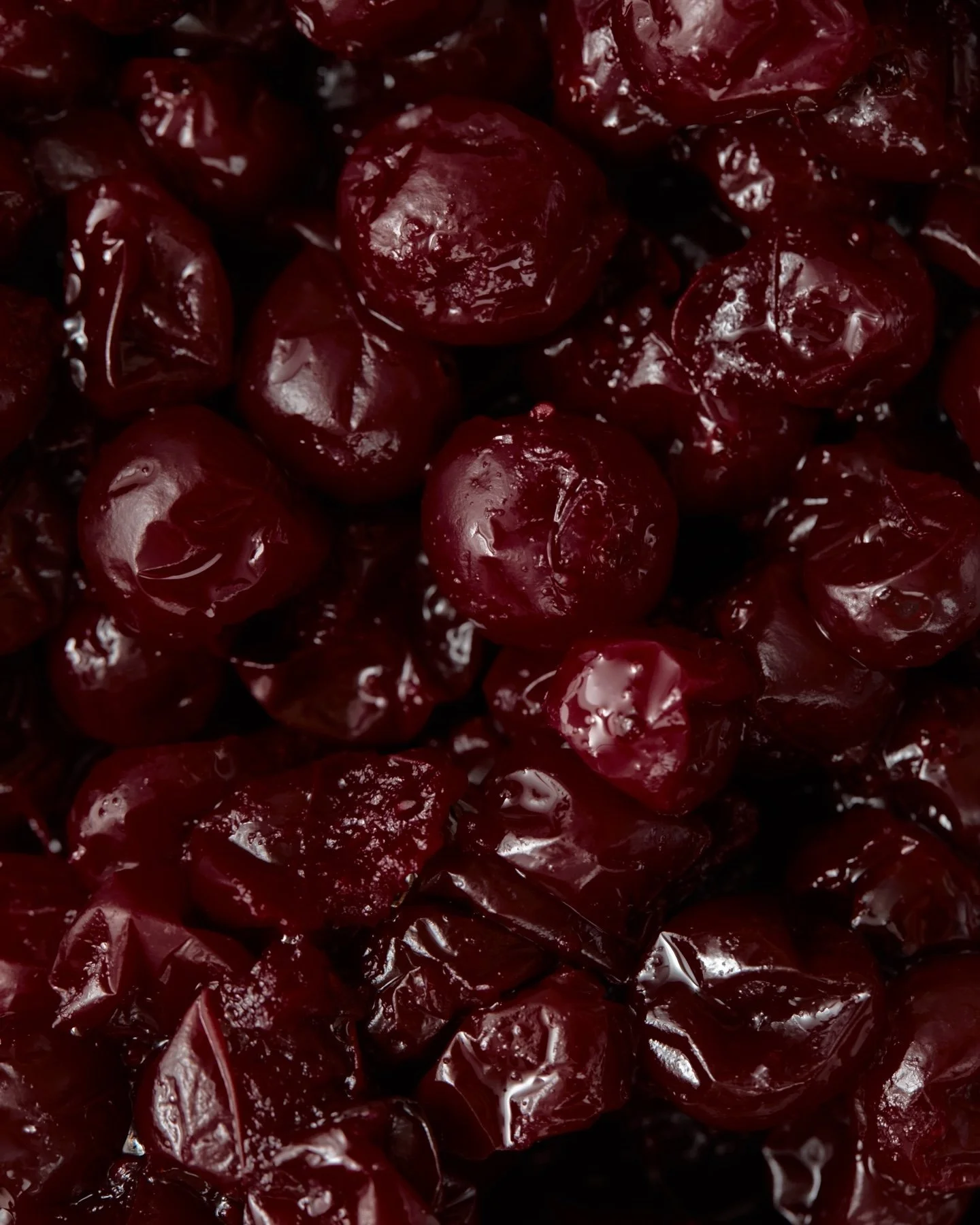 dark red cherries in syrup, close.