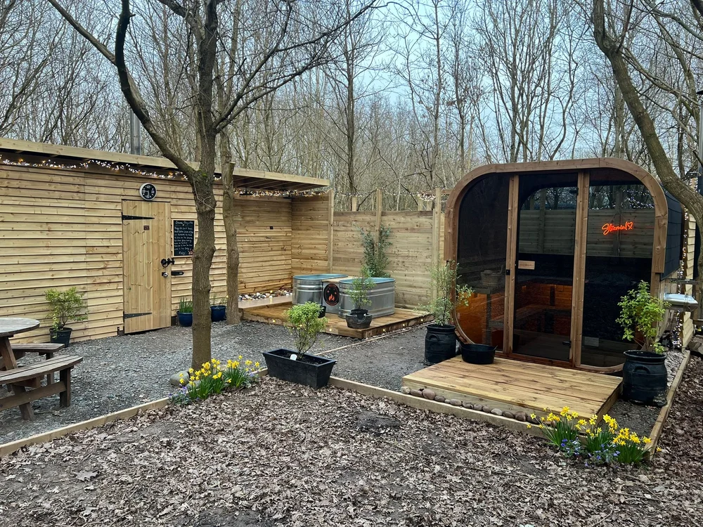The wood-fired woodland sauna among the trees
