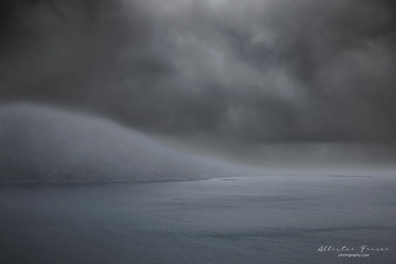 rain storm emerging from the atlantic on the road to tarbert