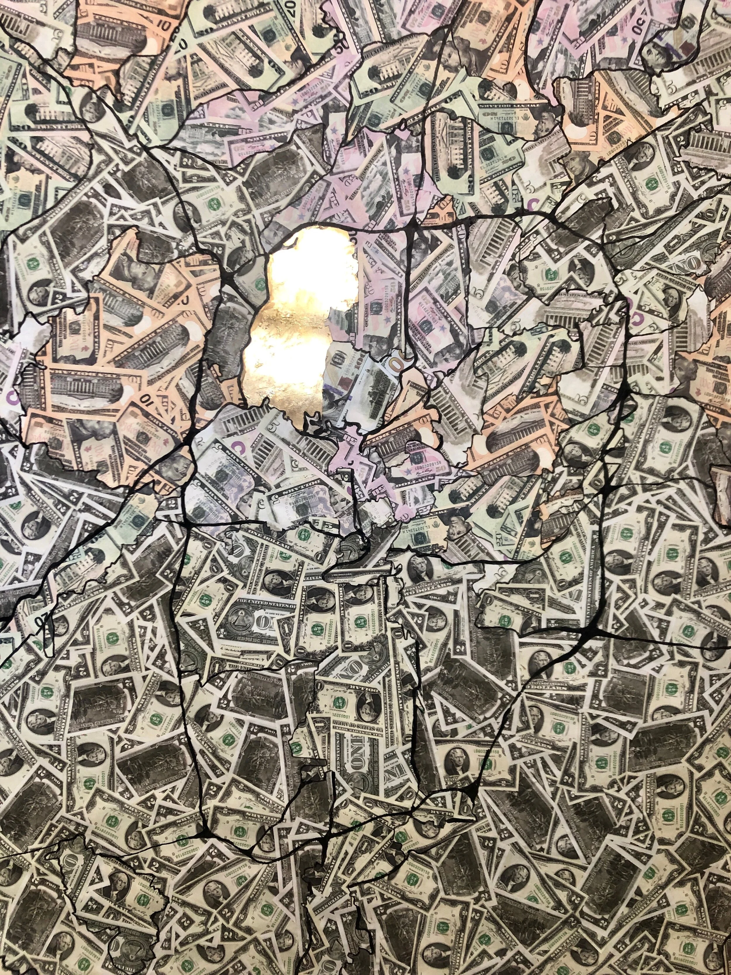 Broken glass with dollar bills underneath, creating a cracked appearance.