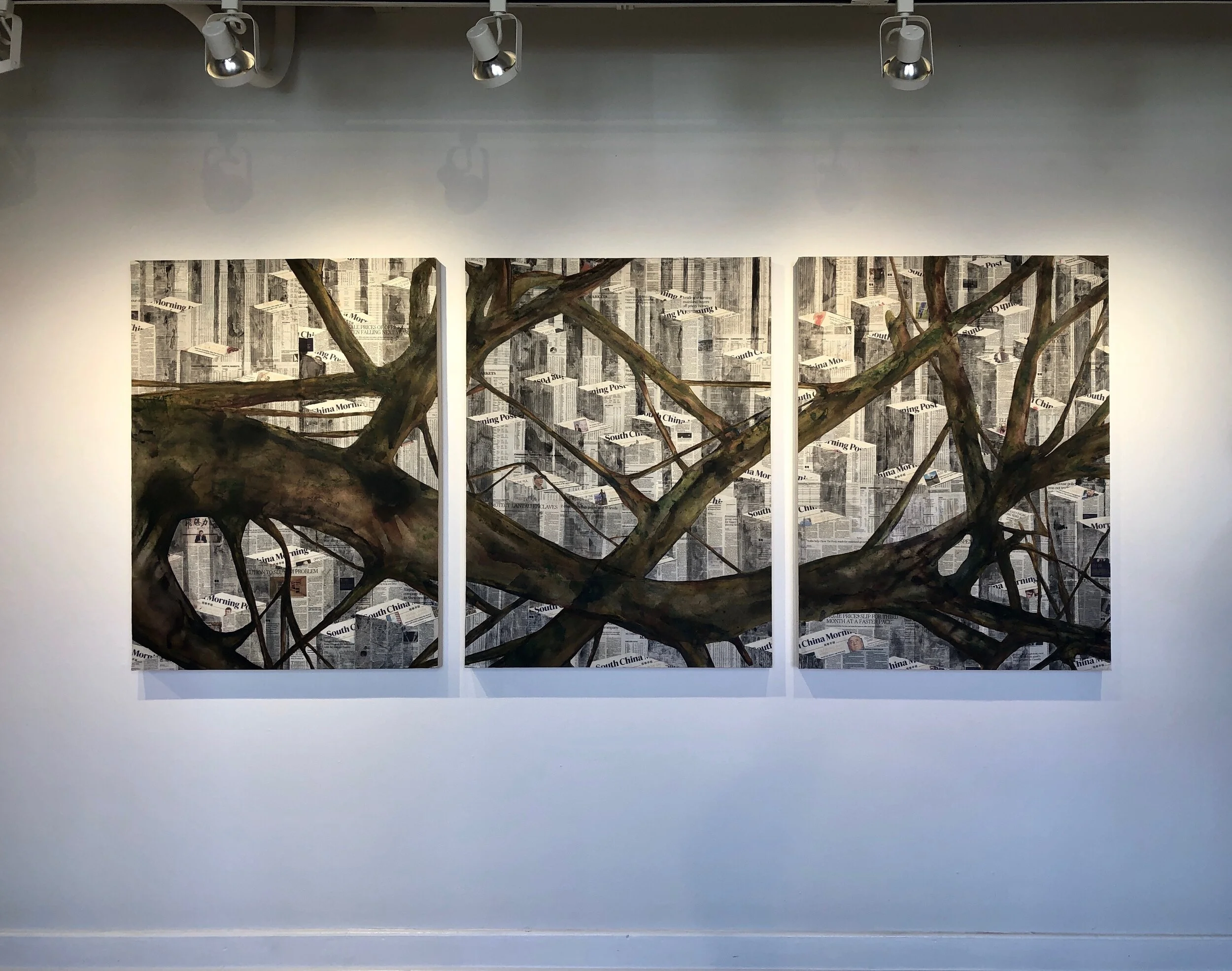 Triptych artwork depicting a tree branch with newspaper background.
