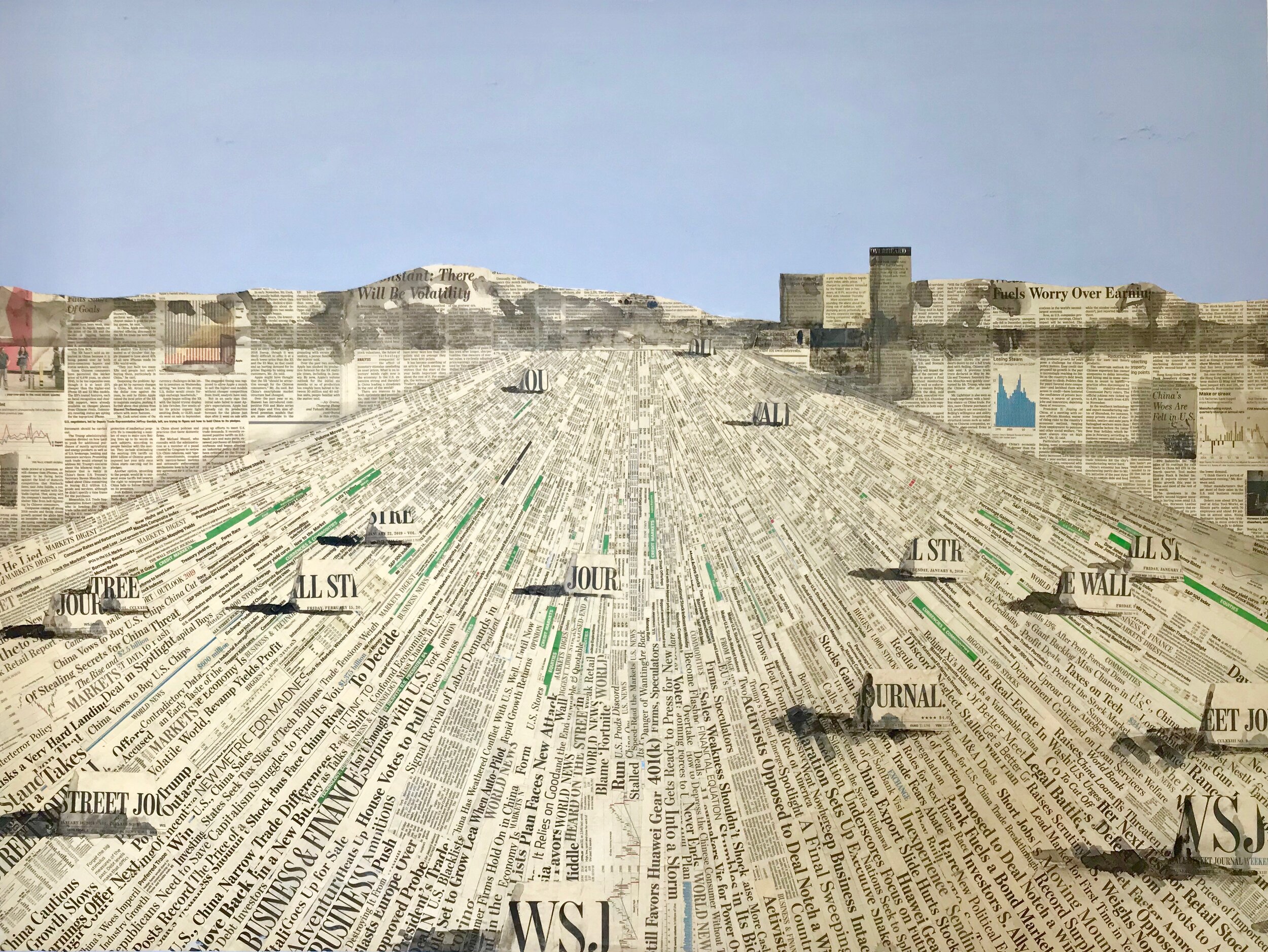 A collage art piece depicting a cityscape with skyscrapers and mountains, made from layered newspaper and magazine clippings.