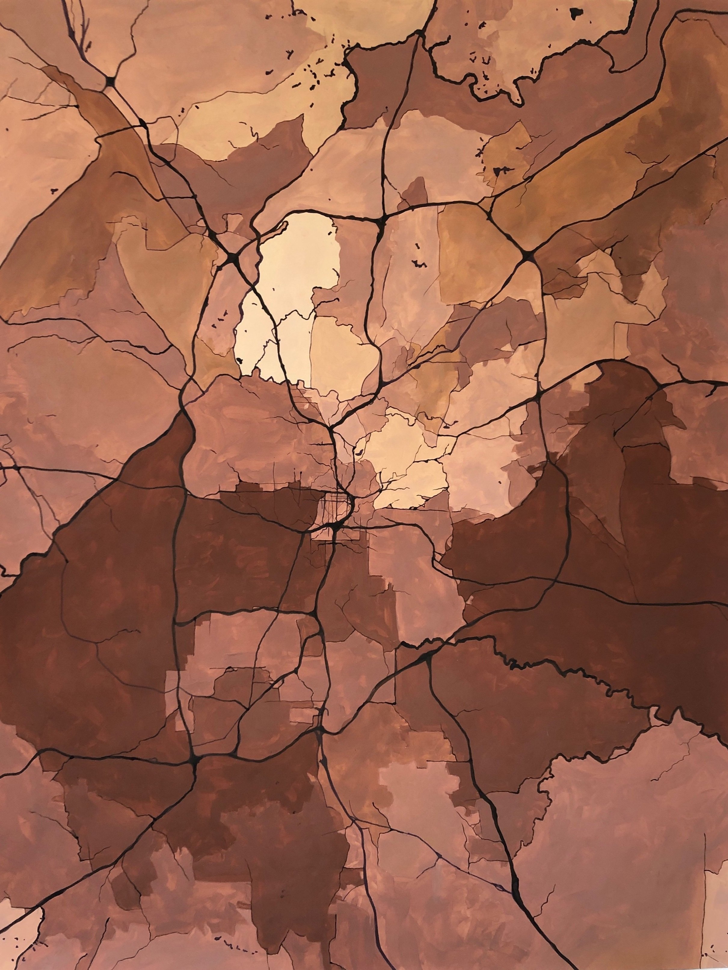 A stylized map showing various regions in shades of brown and tan with black lines representing roads or borders.