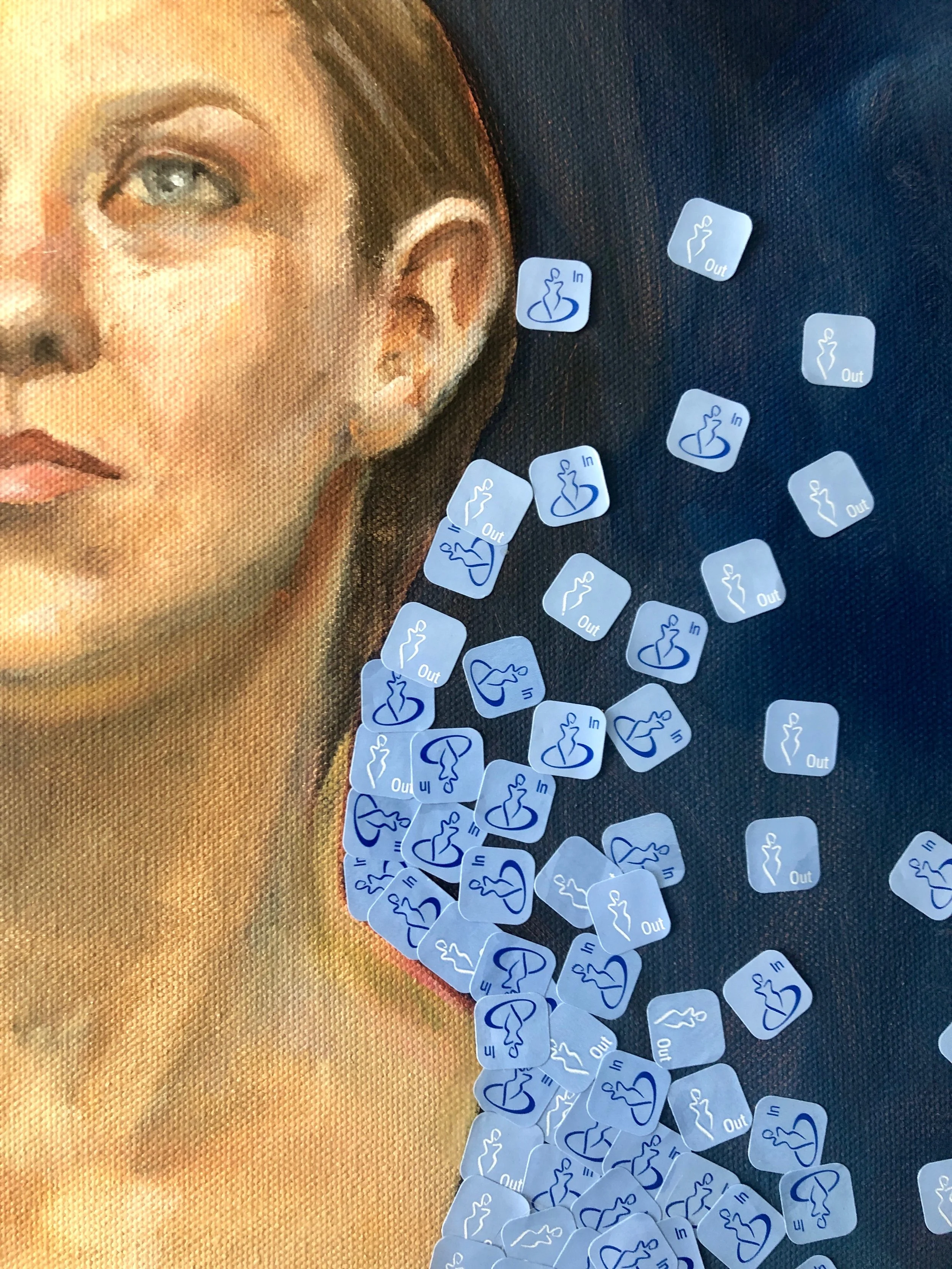 Close-up of a painted portrait of a woman with scattered plastic tattoo stickers on the surface, some overlapping.