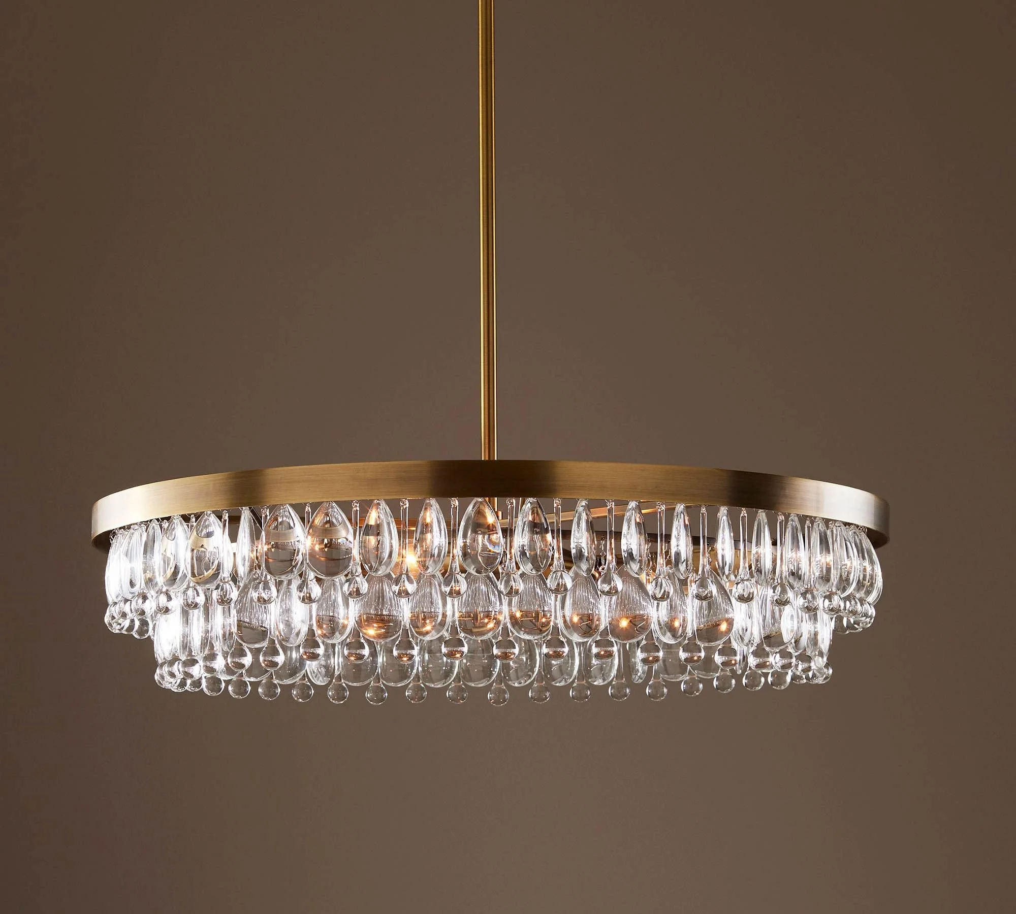 The modern Clarissa lighting collection for Pottery Barn was designed by Industrial Designer CoCo Ree Lemery in 2020. Inspired by the vintage crystal chandelier collection, the modern take ended up becoming a best-seller for the Williams Sonoma brand