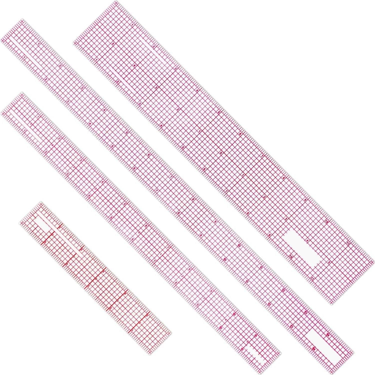 Set of pink plastic rulers with grid markings, laid at angles on a white background.
