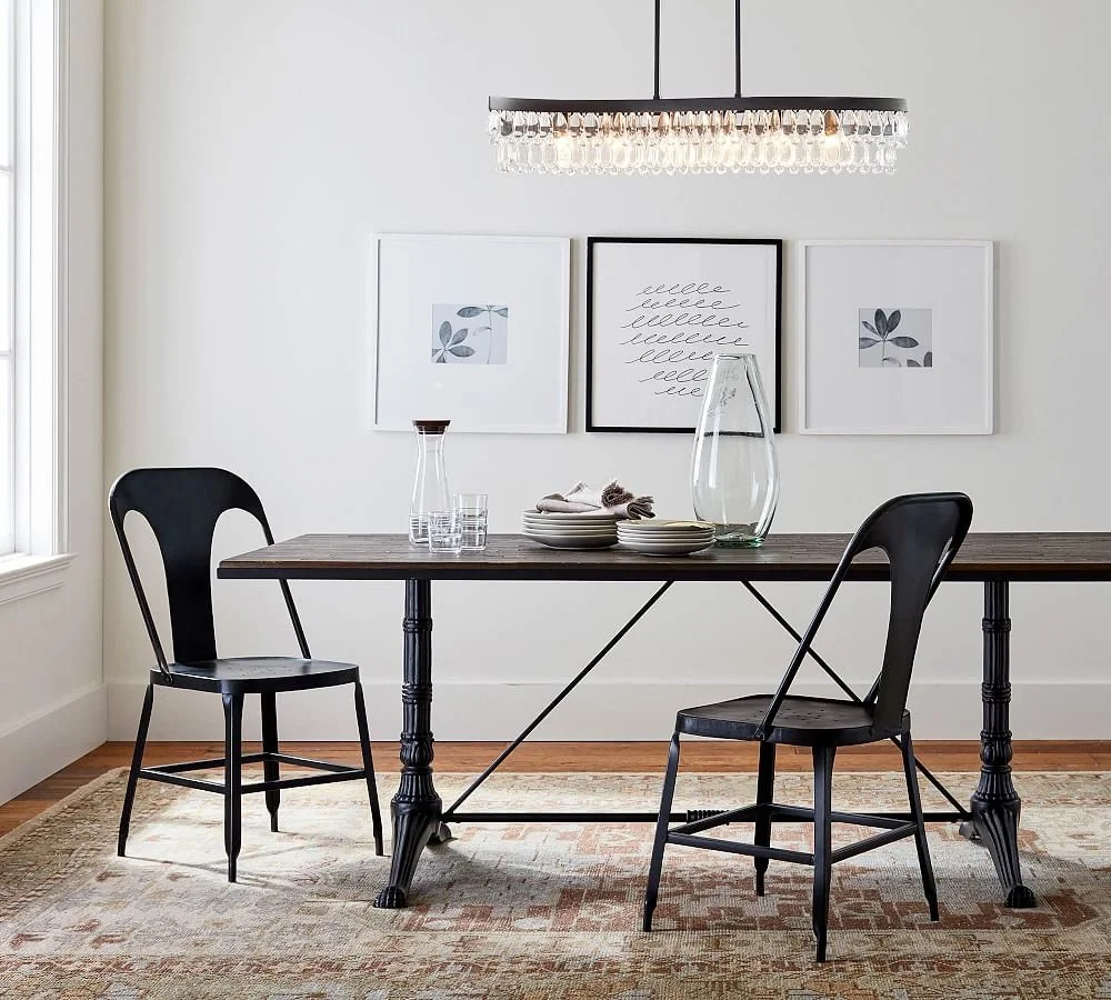The modern Clarissa lighting collection for Pottery Barn was designed by Industrial Designer CoCo Ree Lemery in 2020. Inspired by the vintage crystal chandelier collection, the modern take ended up becoming a best-seller for the Williams Sonoma brand
