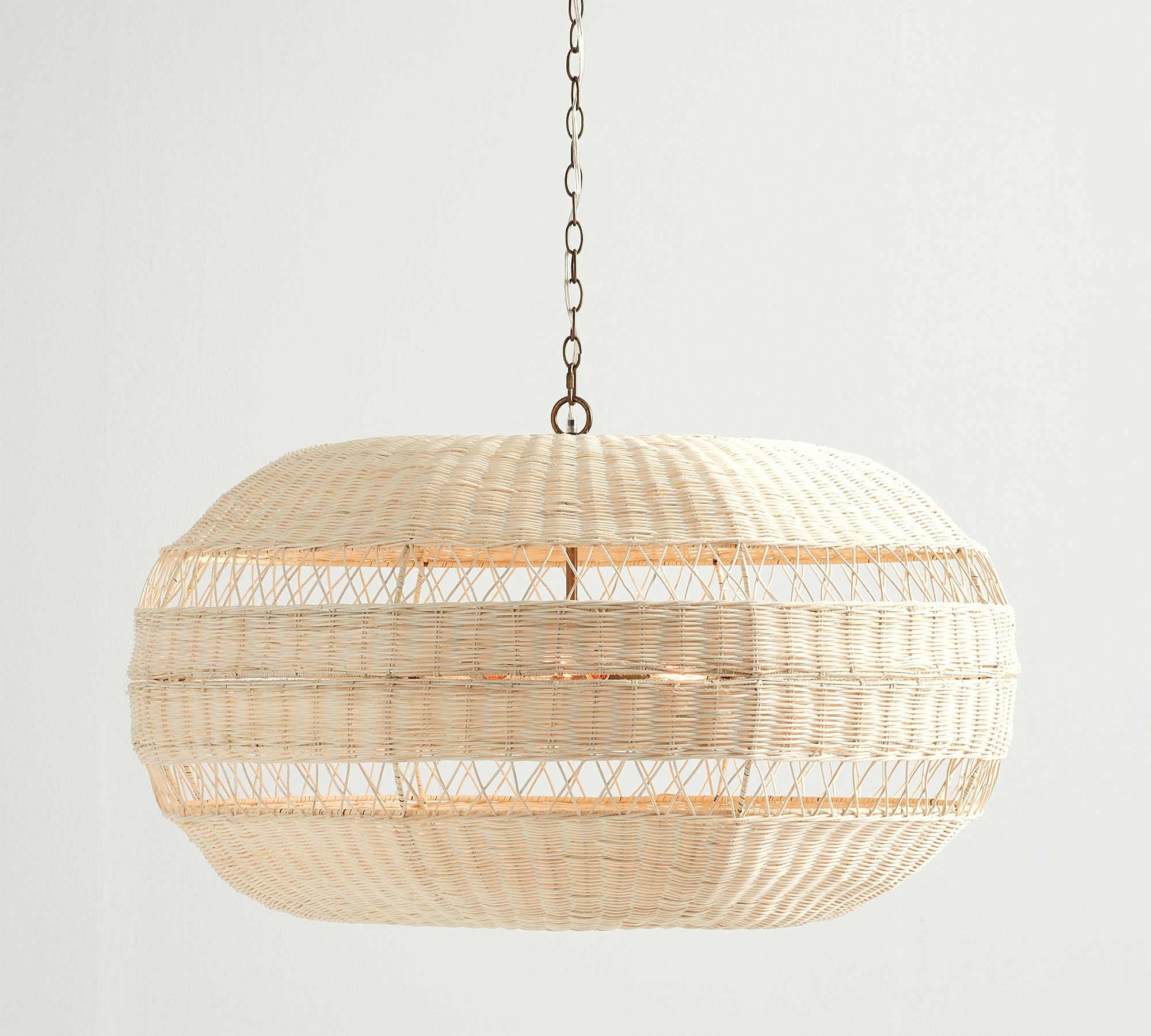Man-made from mother nature, this inviting collection diffuses light softly through a filigree of woven rattan. Whether it recalls summer at the seaside or bohemian chic, each piece has a substantial scale that makes it an ornament for any room.