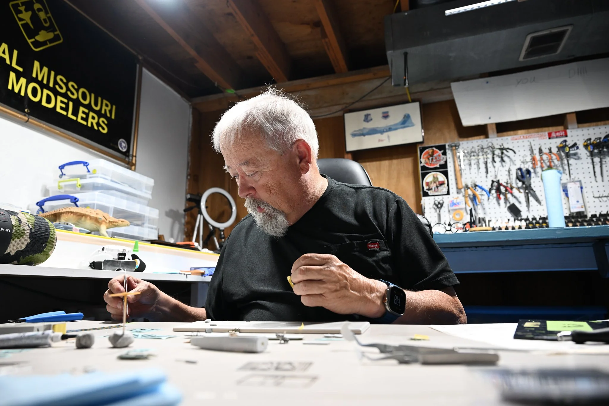 Various pieces of the scale model of the World War One airplane Kent Barnes is currently building are spread across his workstation on Wednesday July 15, 2026, at his residence in Columbia. “I don’t build World War One planes at 1/48th scale very oft
