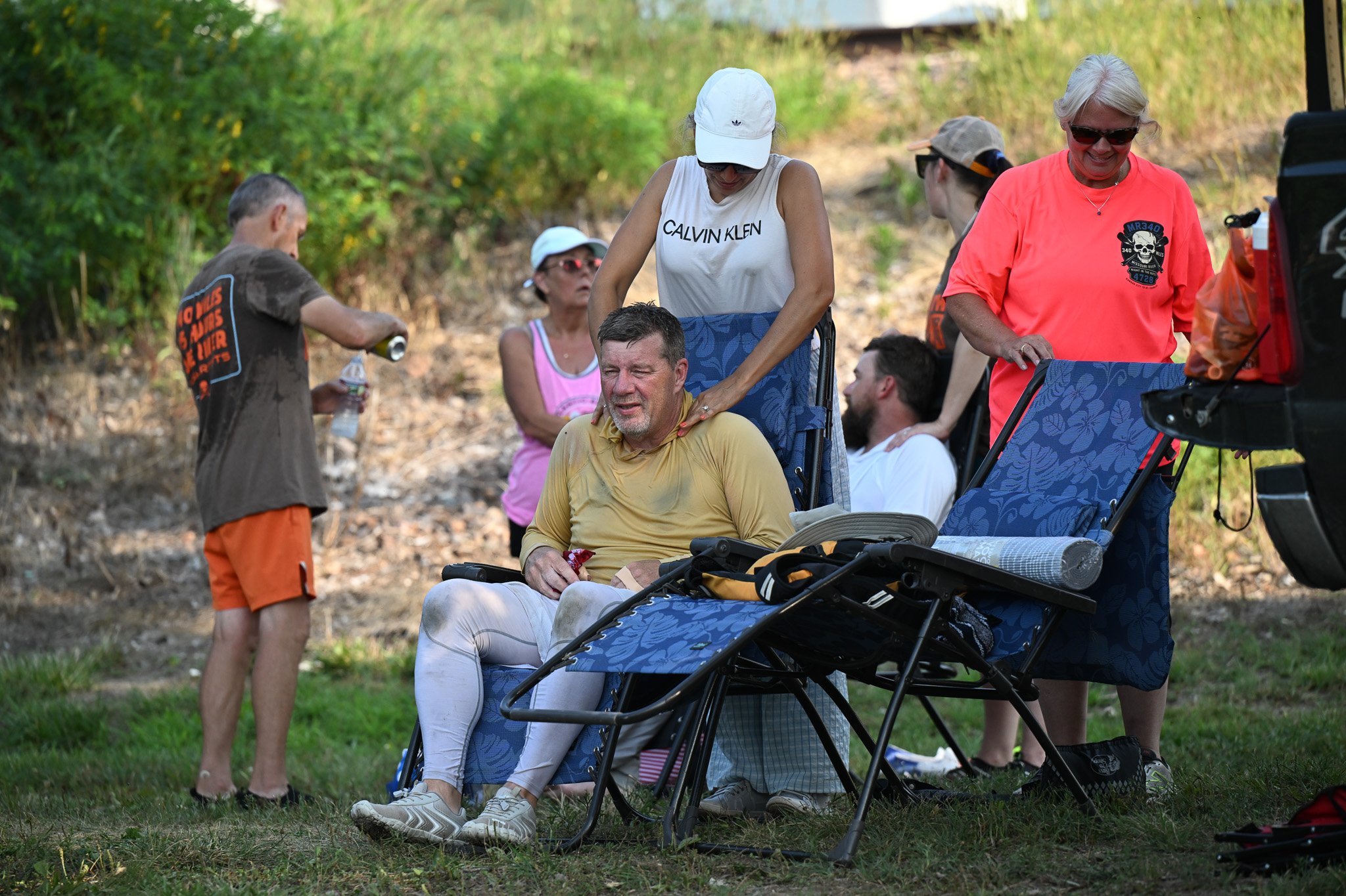 David Amelung, from Arnold, gets a quick massage from a member of his ground crew while stopping at the Port of Waverly on Tuesday, July 28, 2026, in Waverly, Mo. “This is my fifth time racing in it, it is a life changing event, but this probably my 