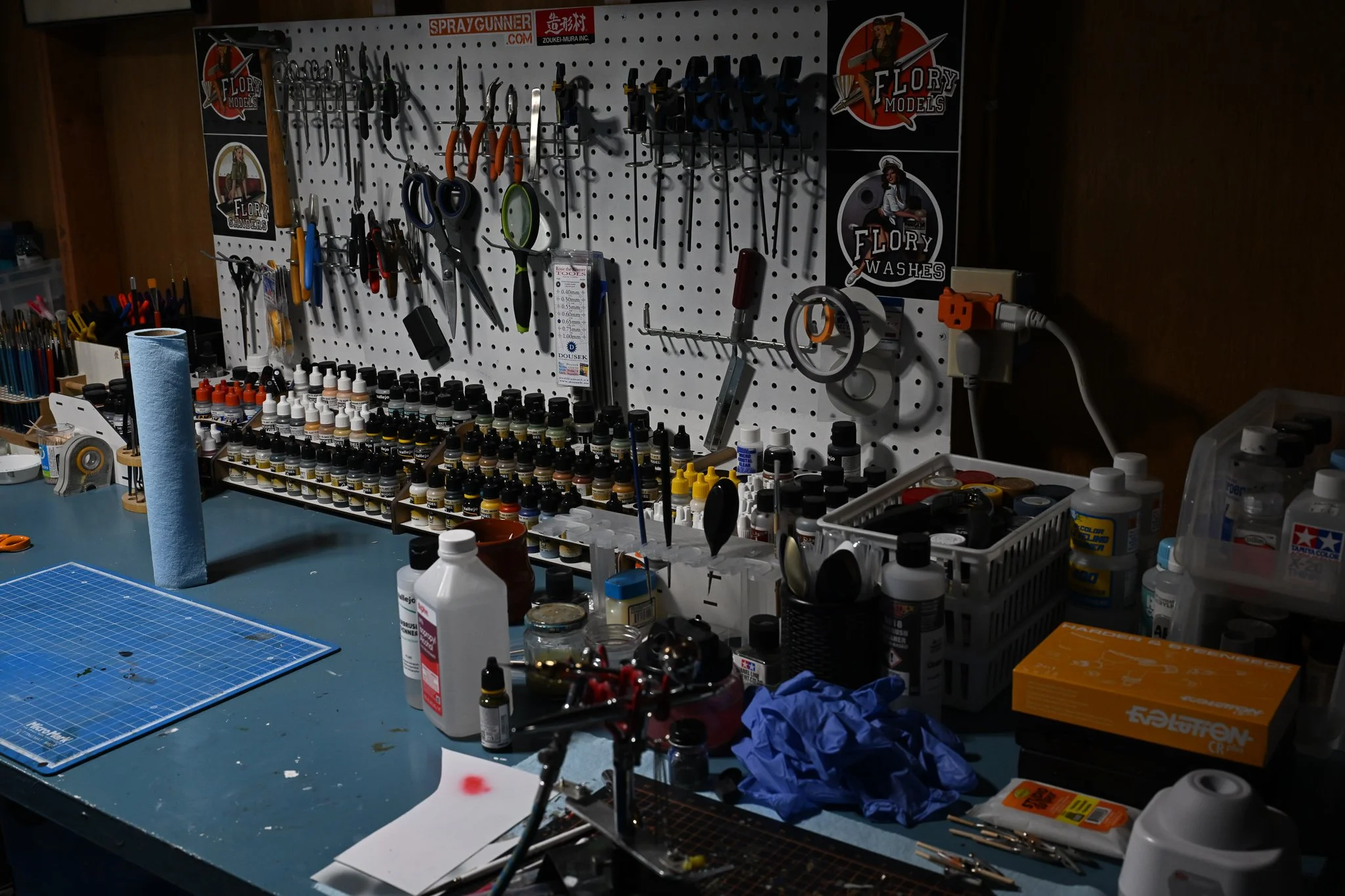 The various paint and tools that Kent Barnes uses to build his scale models at separate worktable on Wednesday July 15, 2026, at his residence in Columbia. “It can be an expensive hobby,” Barnes said. “But I have a wonderful and understanding spouse 