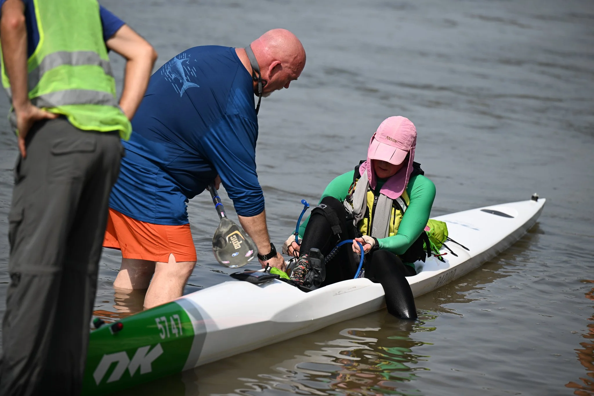 William Broadus, left, helps his wife Kristin Broadus, both from Slidell, Louisiana, launch her kayak, "Bayou Jeepsy,” back into the Missouri River on Tuesday, July 28, 2026, at the Port of Waverly in Waverly Mo. All of Broadus’ previous attempts to 