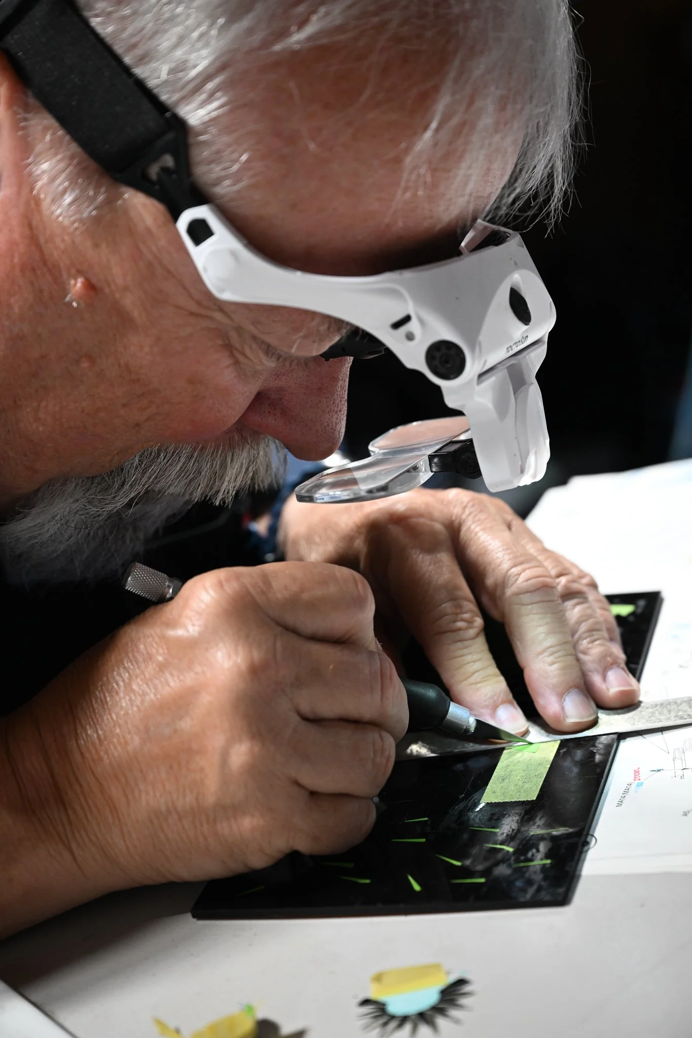 Kent Barnes cut precisely pieces of masking tape for the kit he is currently building on Wednesday July 15, 2026, at his residence in Columbia. "Originally, there was decal that supposed to be used," Barnes said. “But the decal kept falling apart, so