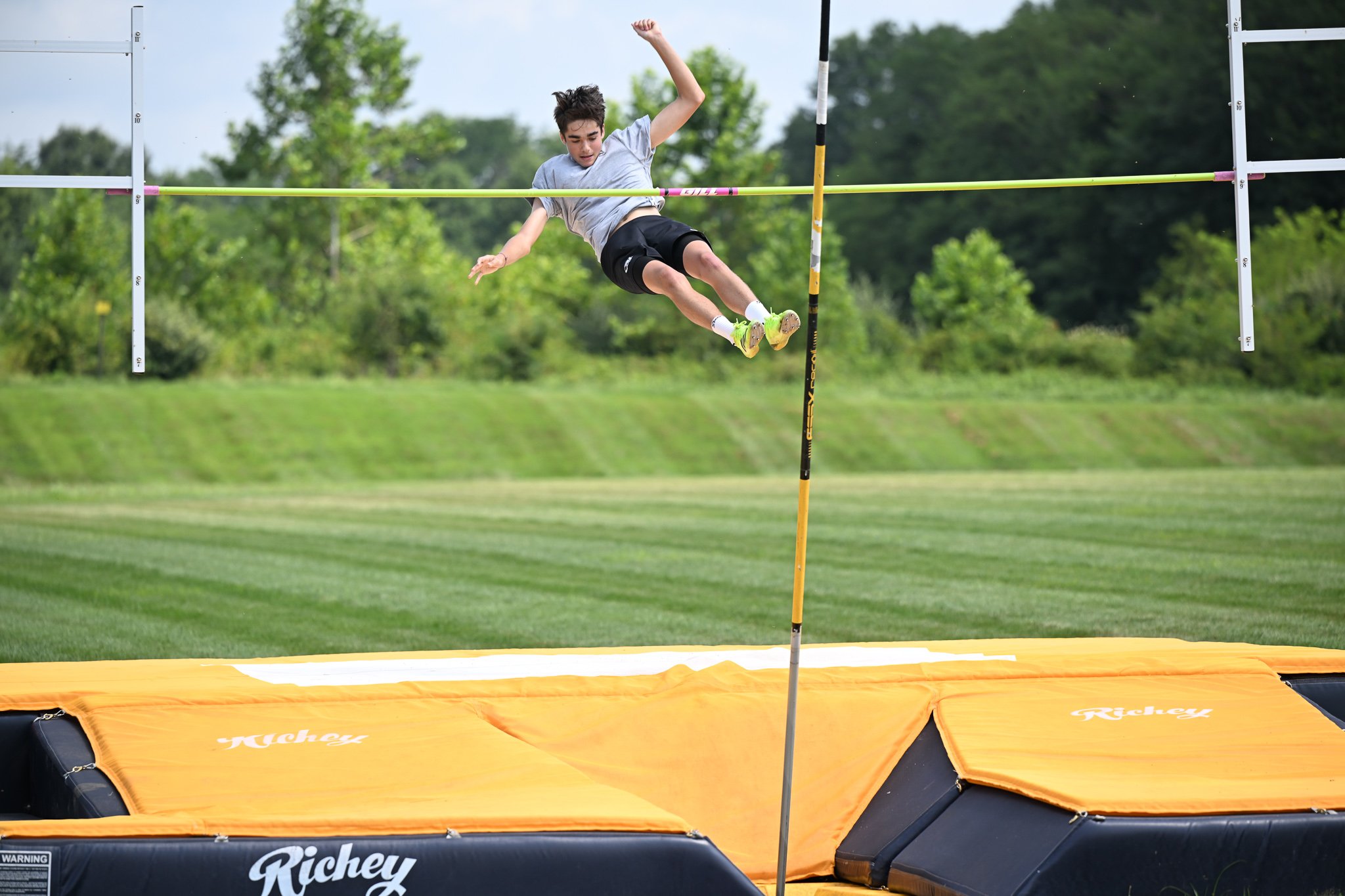 Kai Cherry, 14 of Columbia, clears on his first attempt at the boys pole vault in the Show Me State games Track and Field event on Saturday, July 25, 2026, at Battle High School in Columbia. “I like to do crazy stuff,” Kai said. “And it looked fun.”