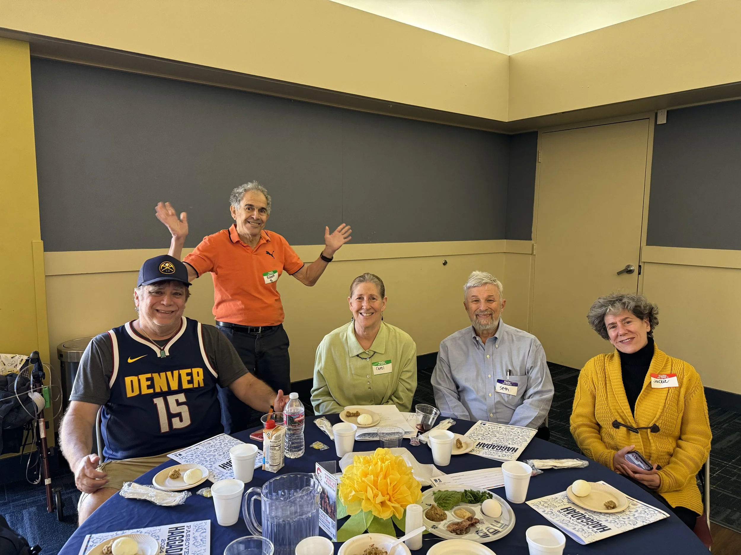 Group of older adults at a table.