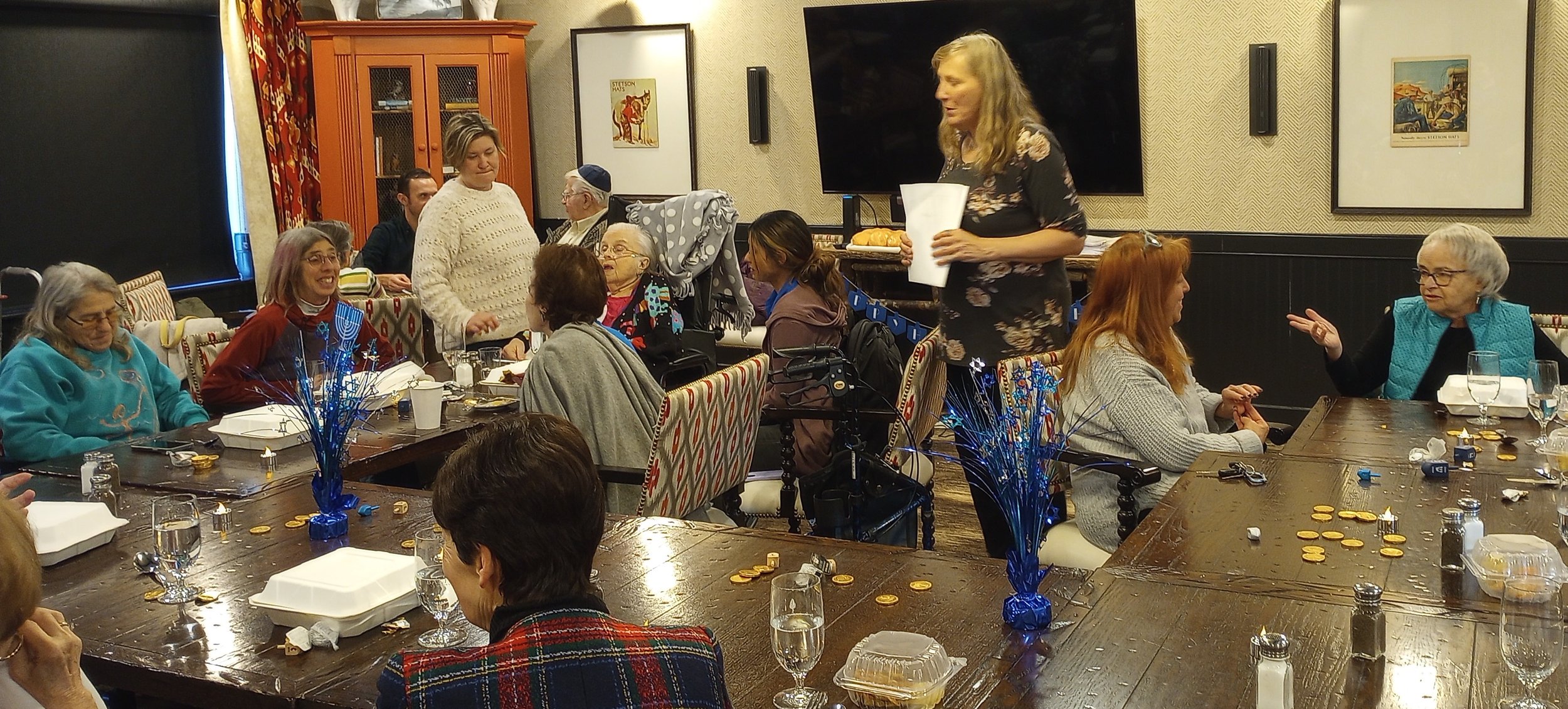 JFS Boulder Community Outreach Liaison leads a lively discussion on the meaning of the holiday at Balfour Lodge.jpg
