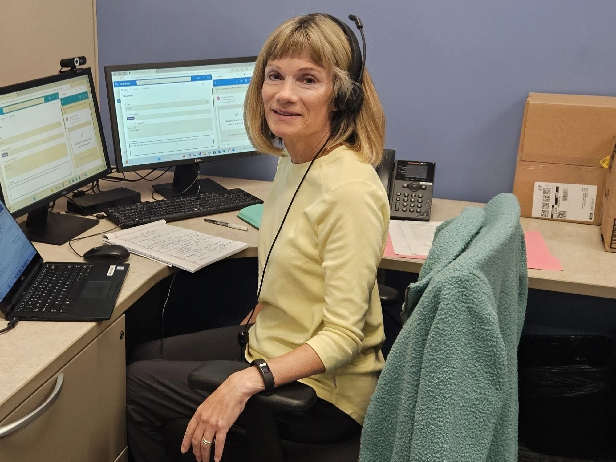 Volunteer working at a computer.