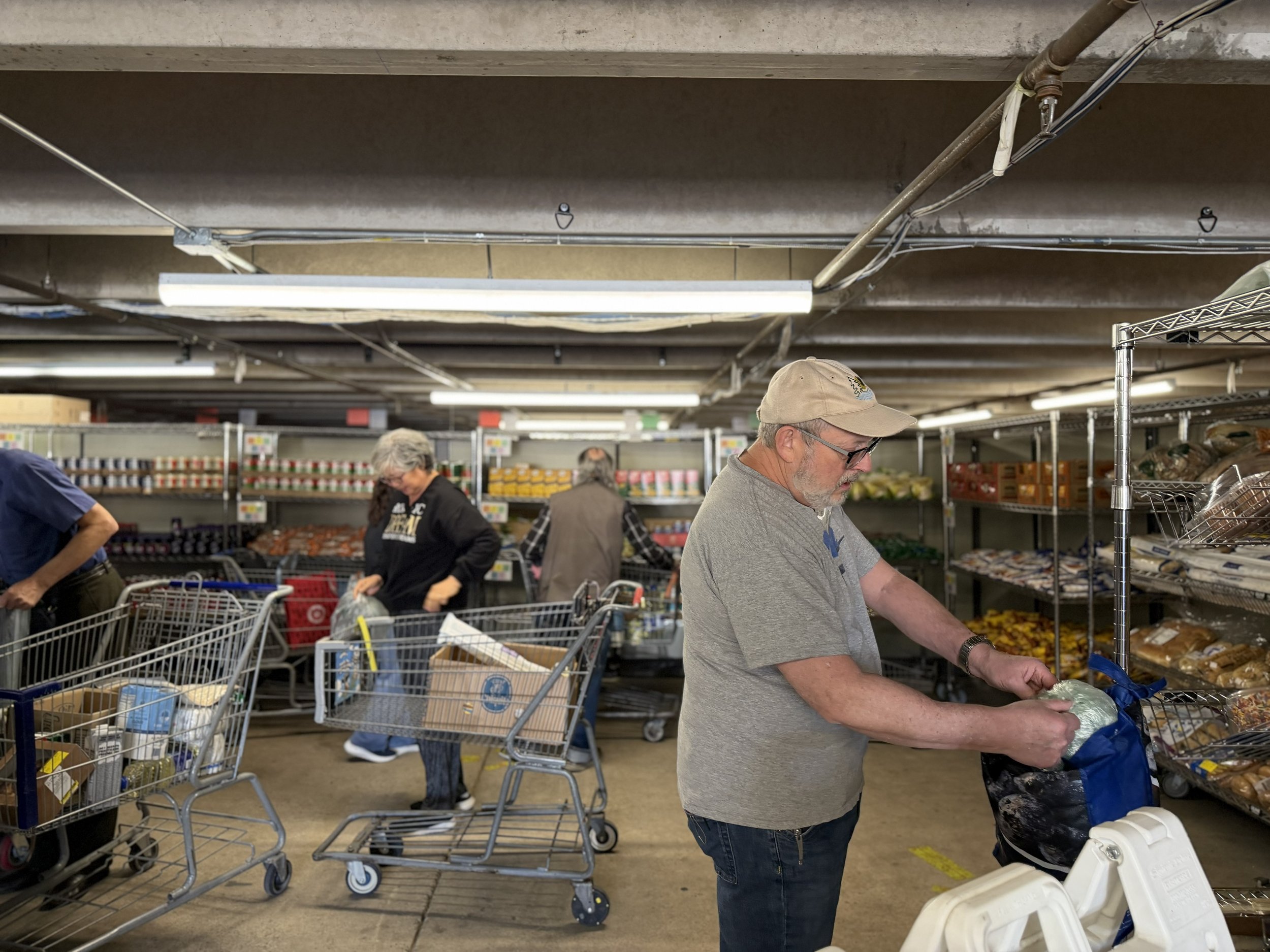 Clients and volunteers in the JFS Weinberg Food Pantry.jpeg