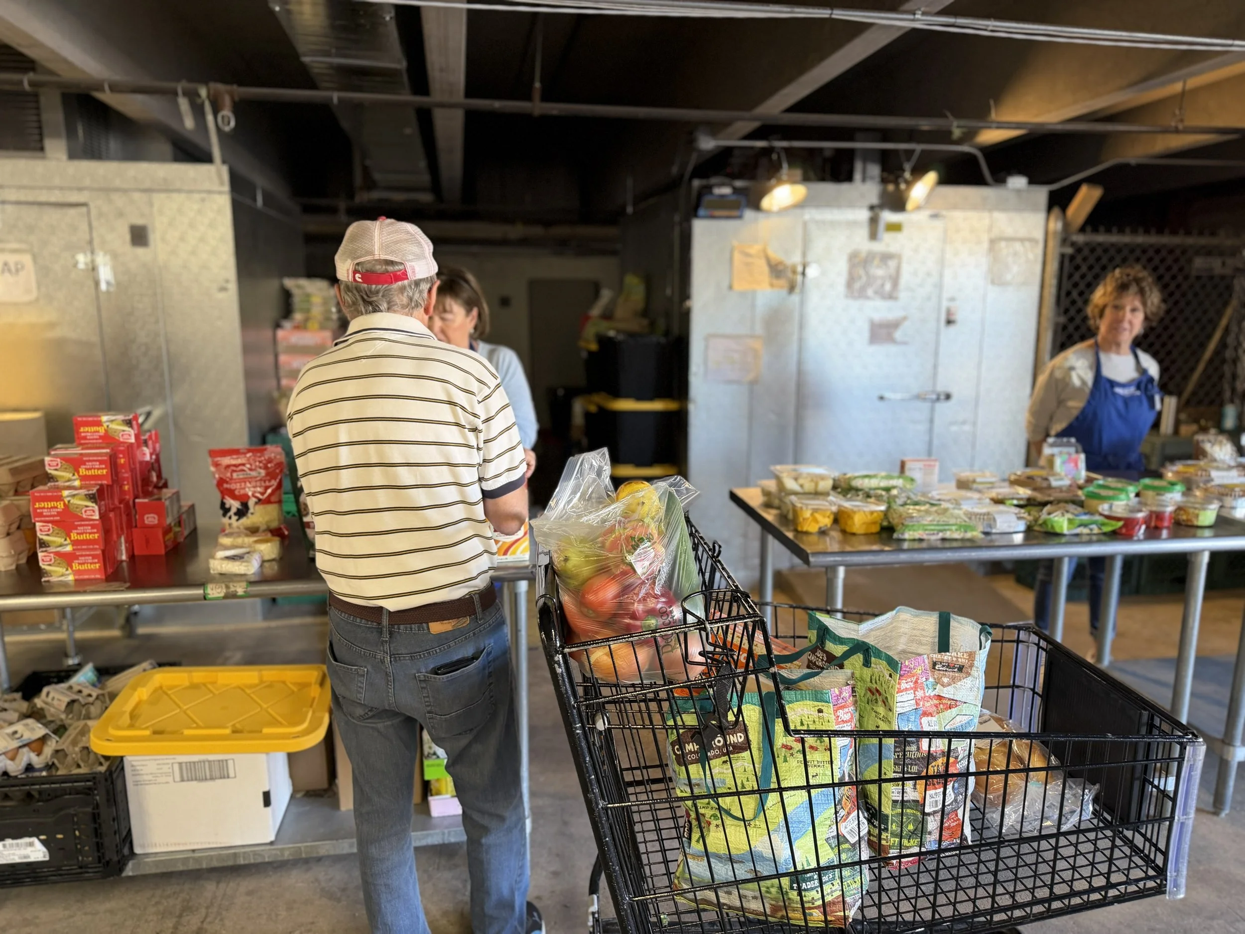 Client and volunteers in the JFS Weinberg Food pantry (1).jpg