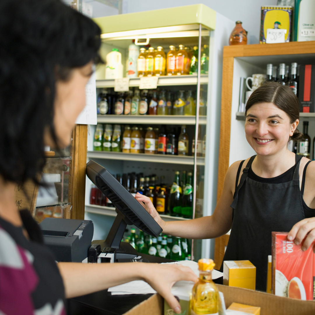 Person working as a cashier at a store.