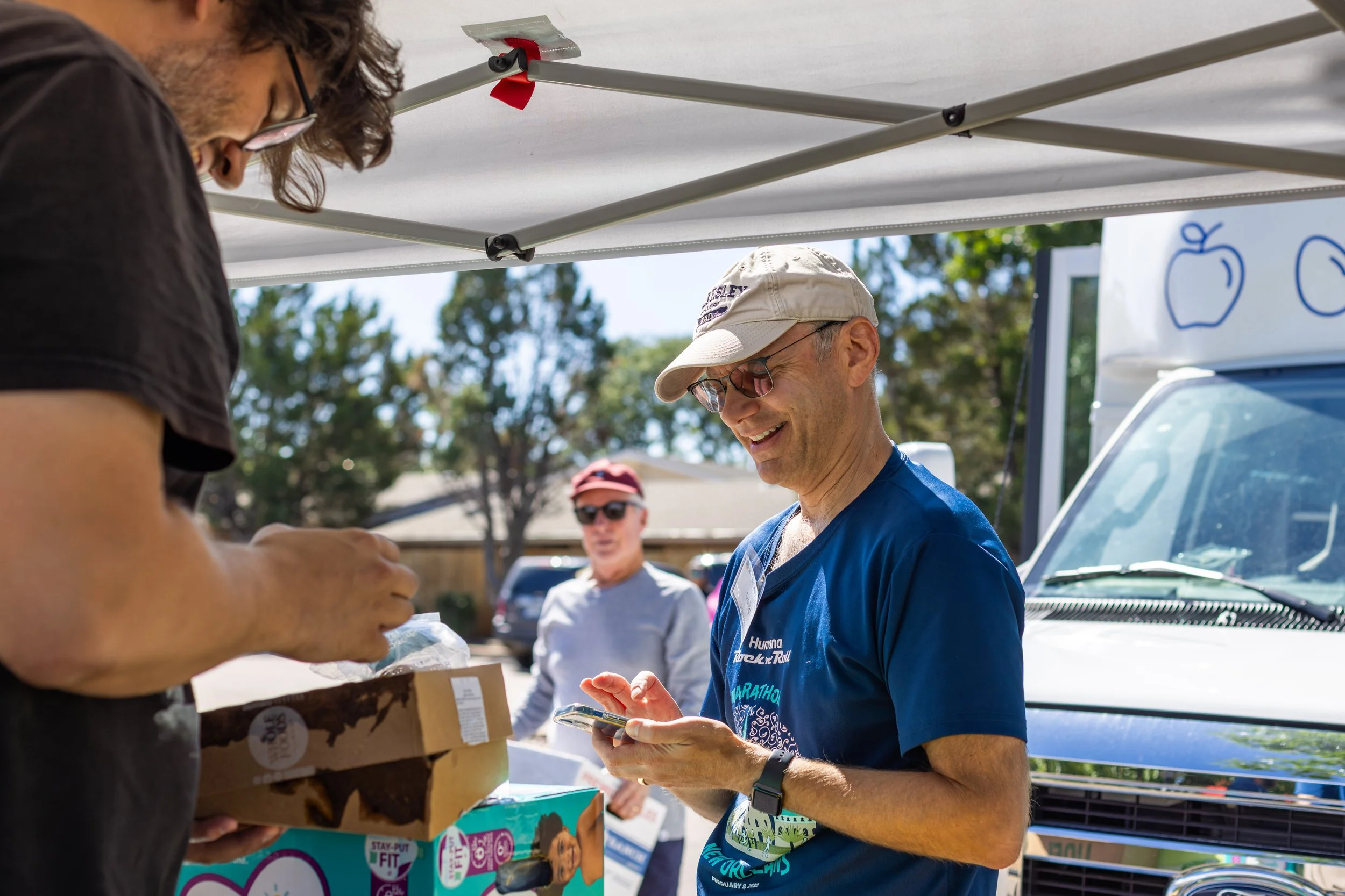 Person outside a mobile food pantry.