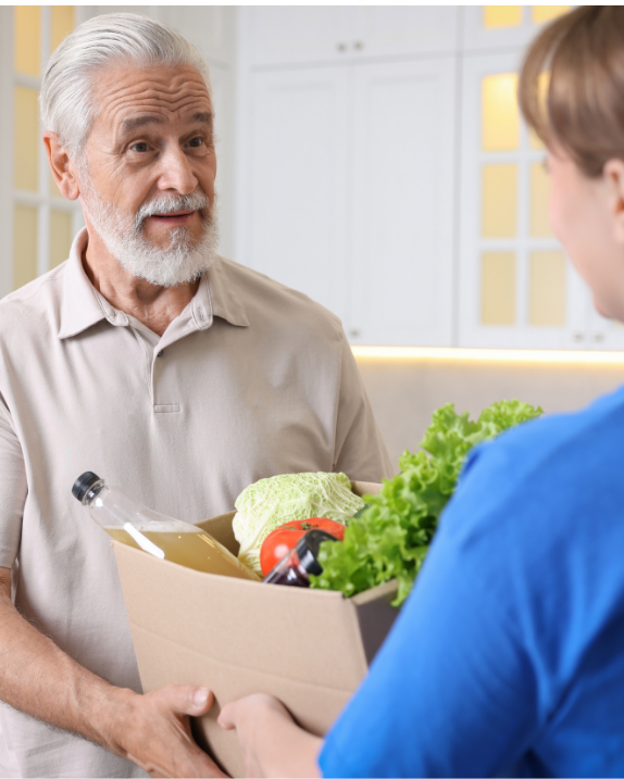 Older adult getting a food delivery.