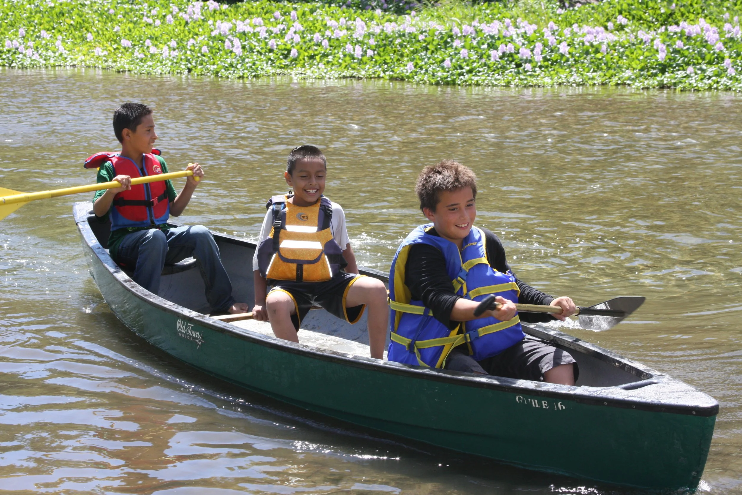 3 boys in canoe.JPG