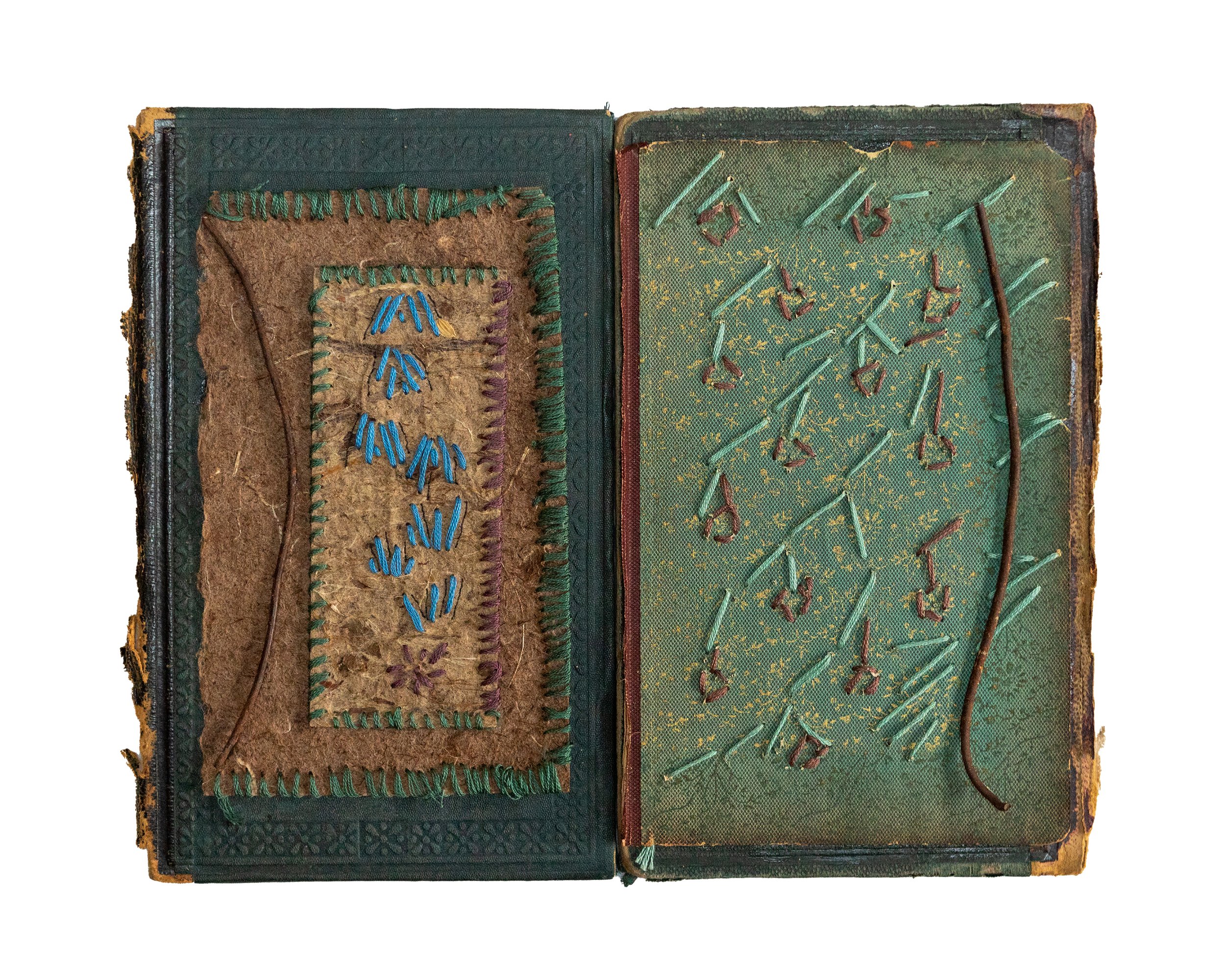 Library 11W x 9H $250—Antique book covers, handmade paper, metal, and thread