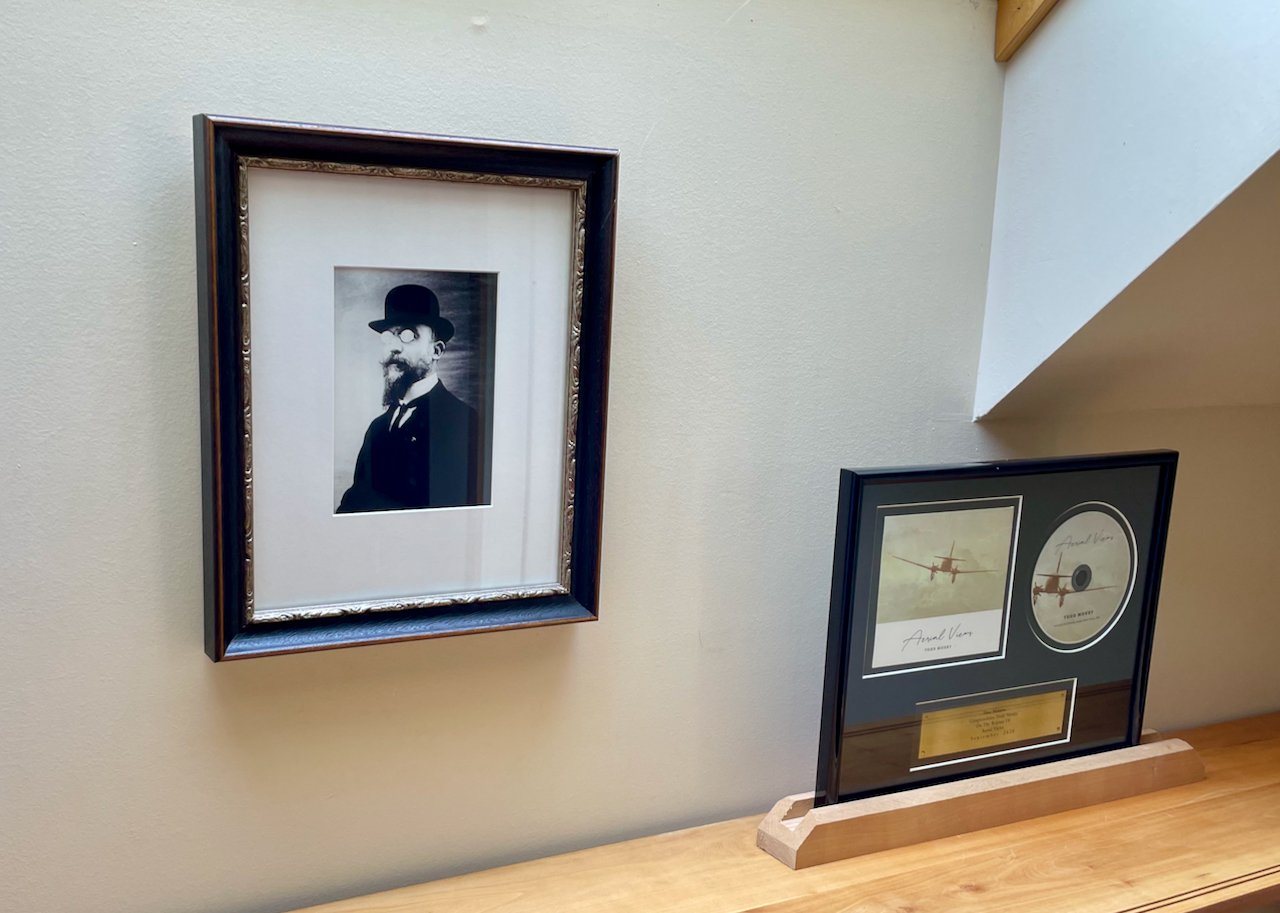  A portrait of composer Erik Satie, one of Ackerman’s biggest inspirations, hangs in the studio foyer. 